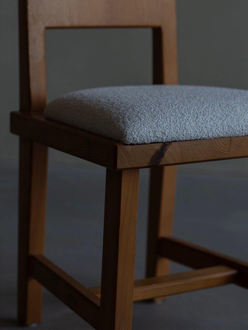 Göran Malmvall - Model 553 — side angle of wooden chair with gray seat