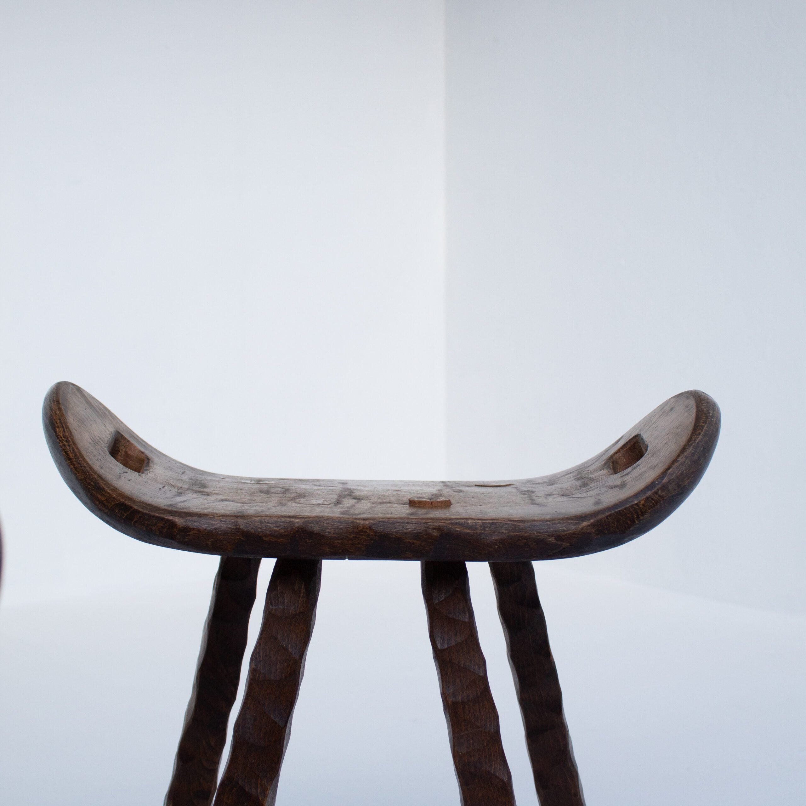 Set of Brutalist stools — top view of handcrafted wooden seat