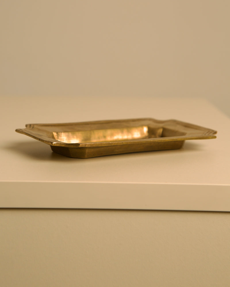 Small Italian brass trinket tray with warm lighting detail