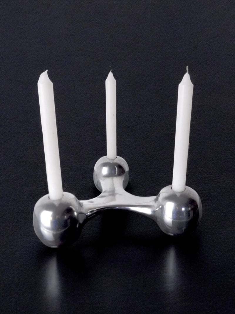 Scandinavian Candleholder, Denmark, 1970s — close-up of polished metal surface with three candles