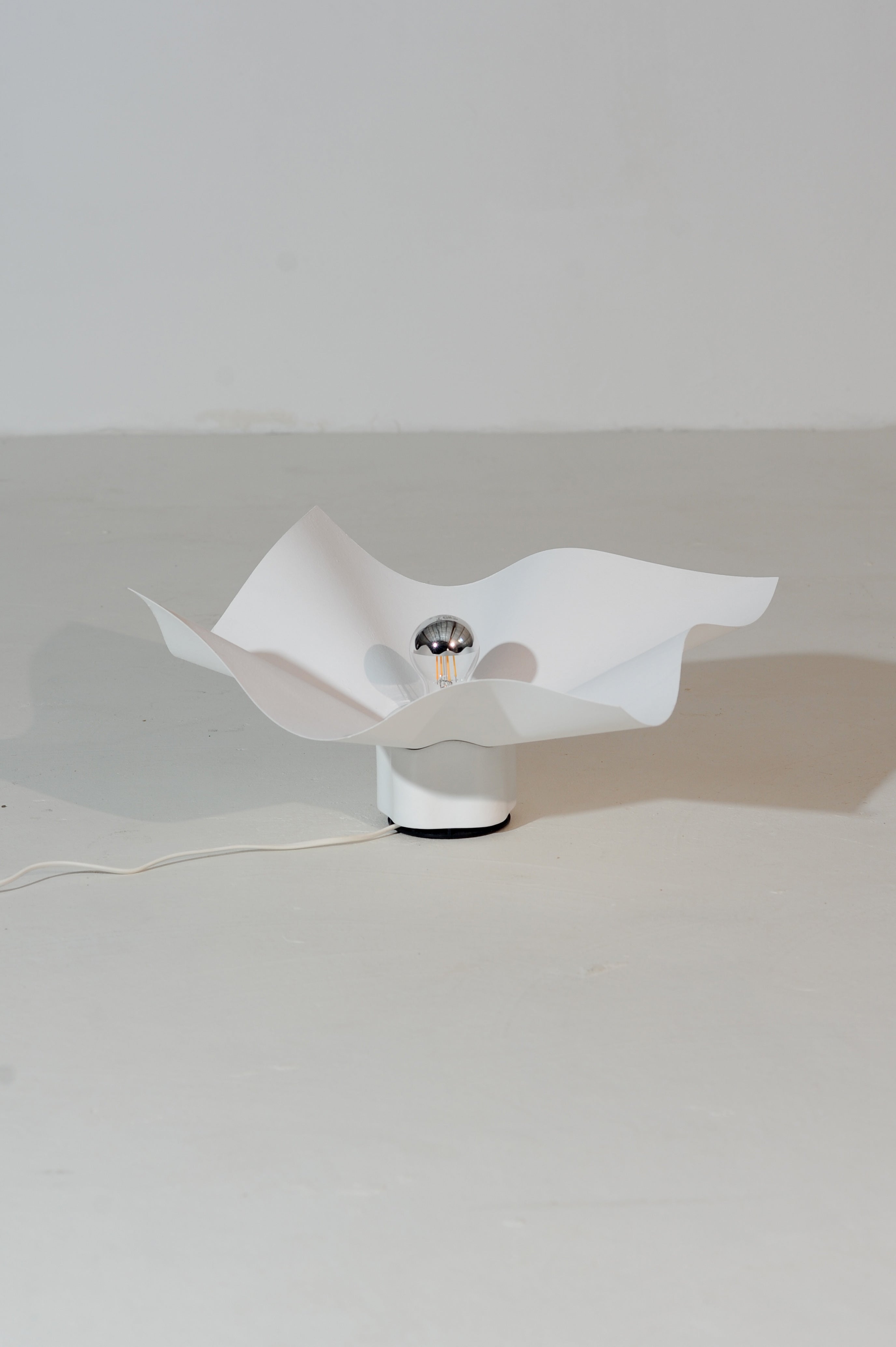 Mario Bellini Area Lamp, Italy 1974 — angled view on white floor
