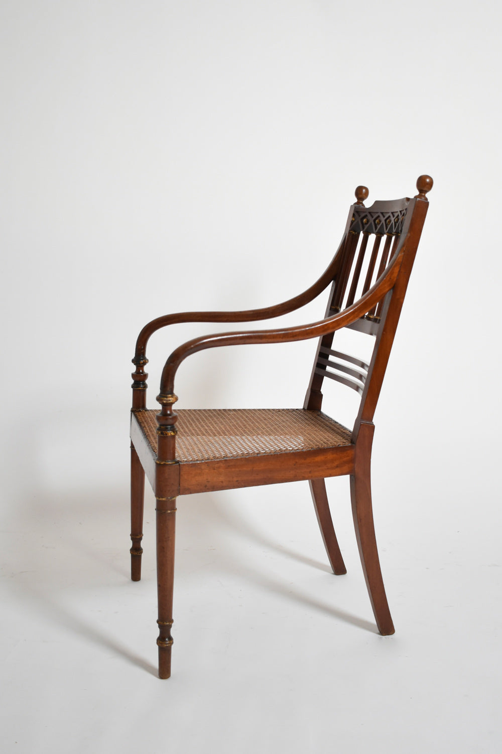 Pair of George III style armchairs, XIXth c. — side angle showing wooden frame and woven seat