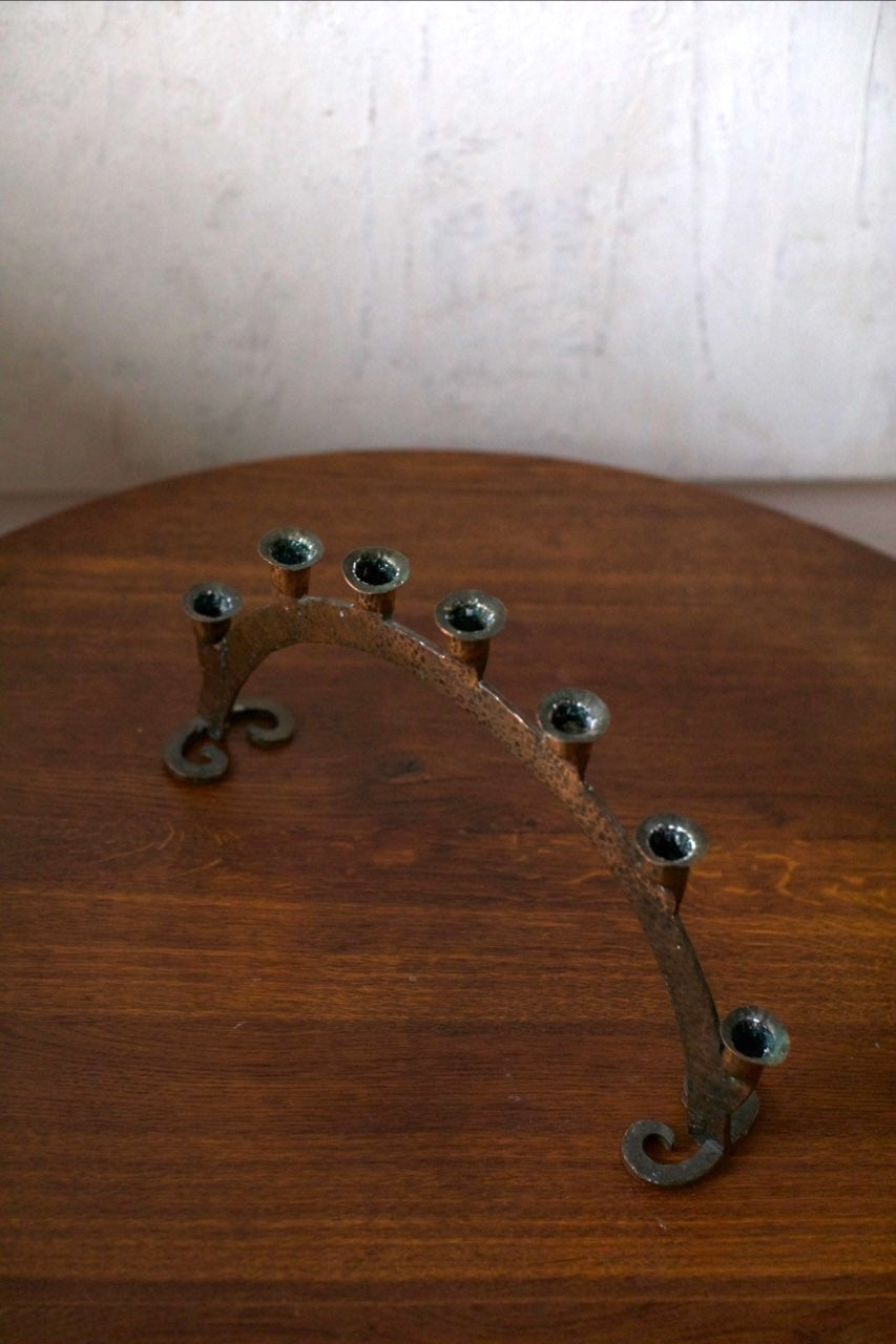 Bronze Candleholder — back view on wooden table
