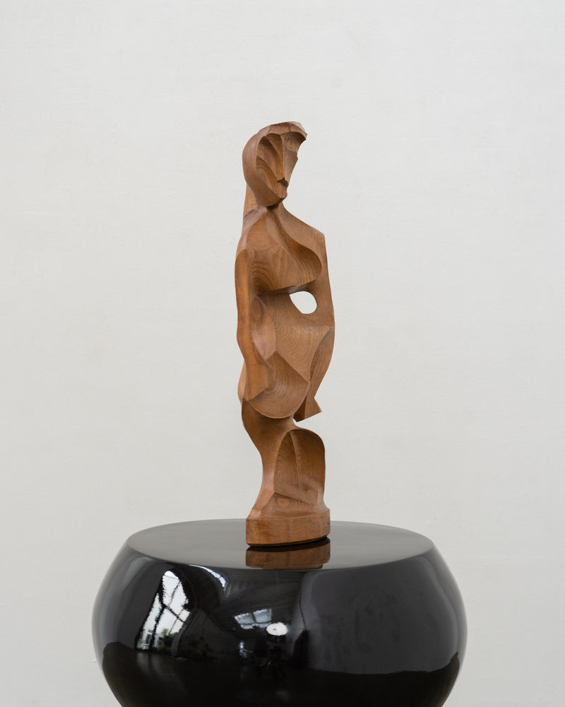 Cubist wooden figurative sculpture on black ceramic base