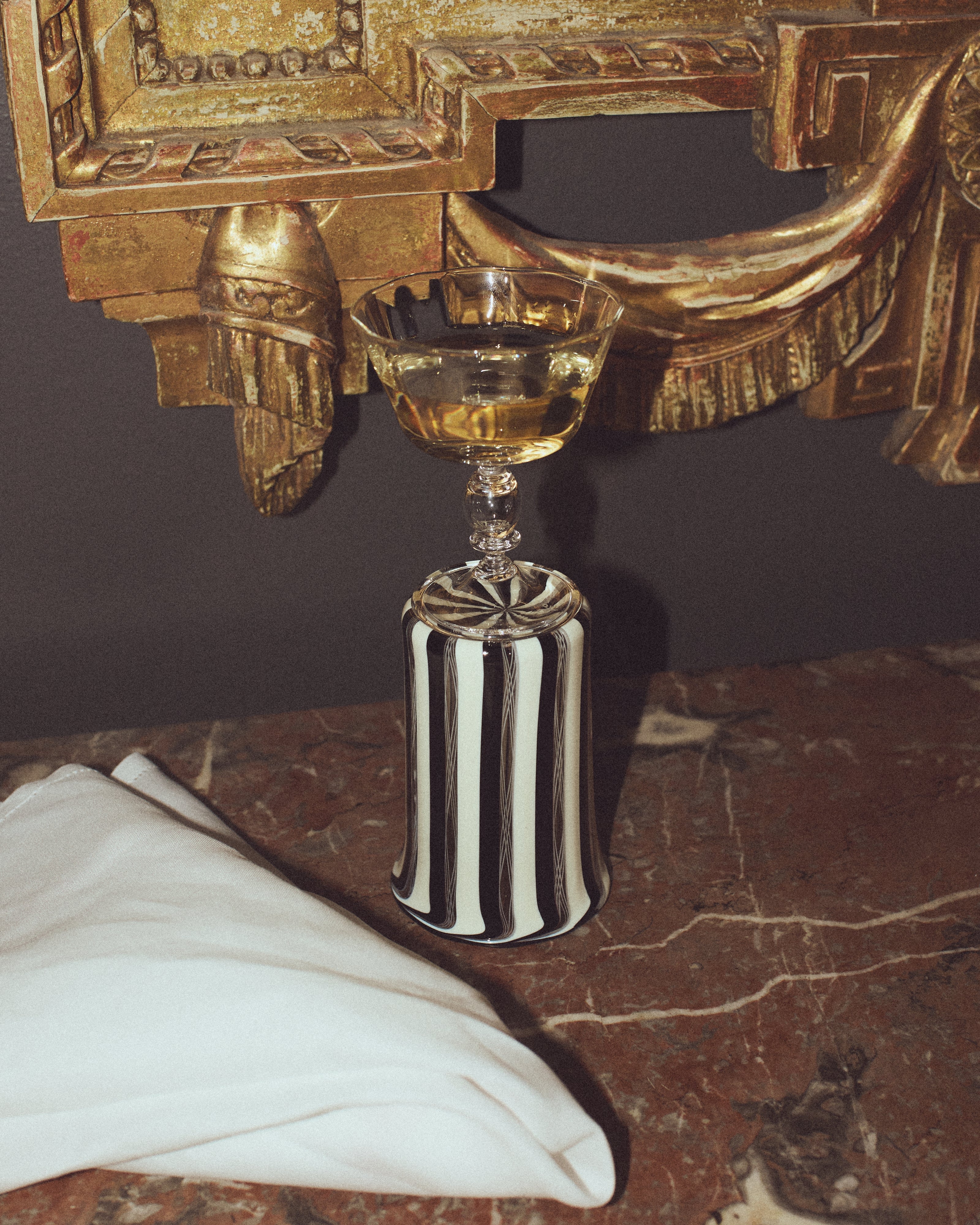 Alban Champagne Glass - Set of Four — angled view on marble surface