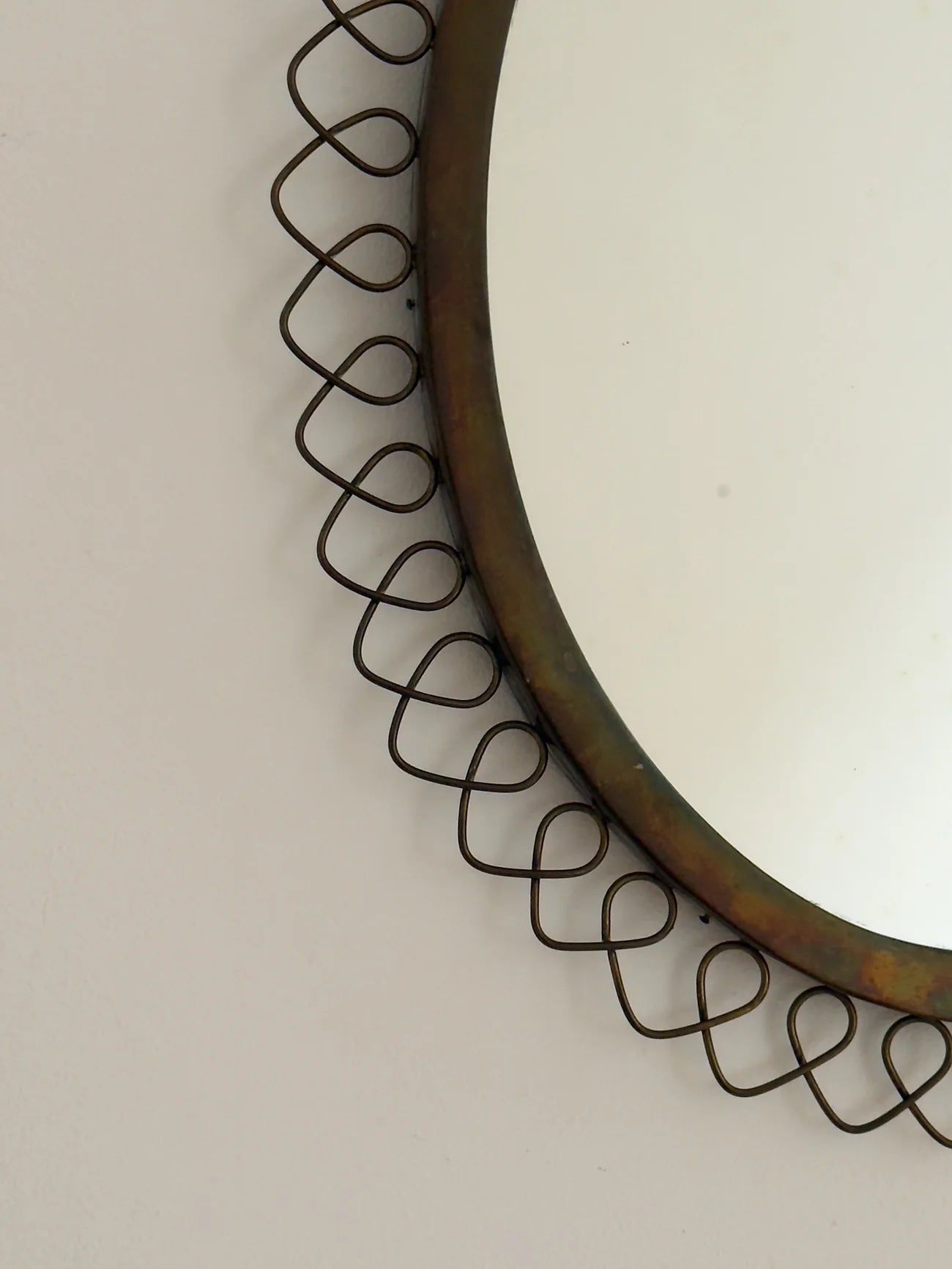 Sculptural Brass Mirror — side angle showing textured brass frame