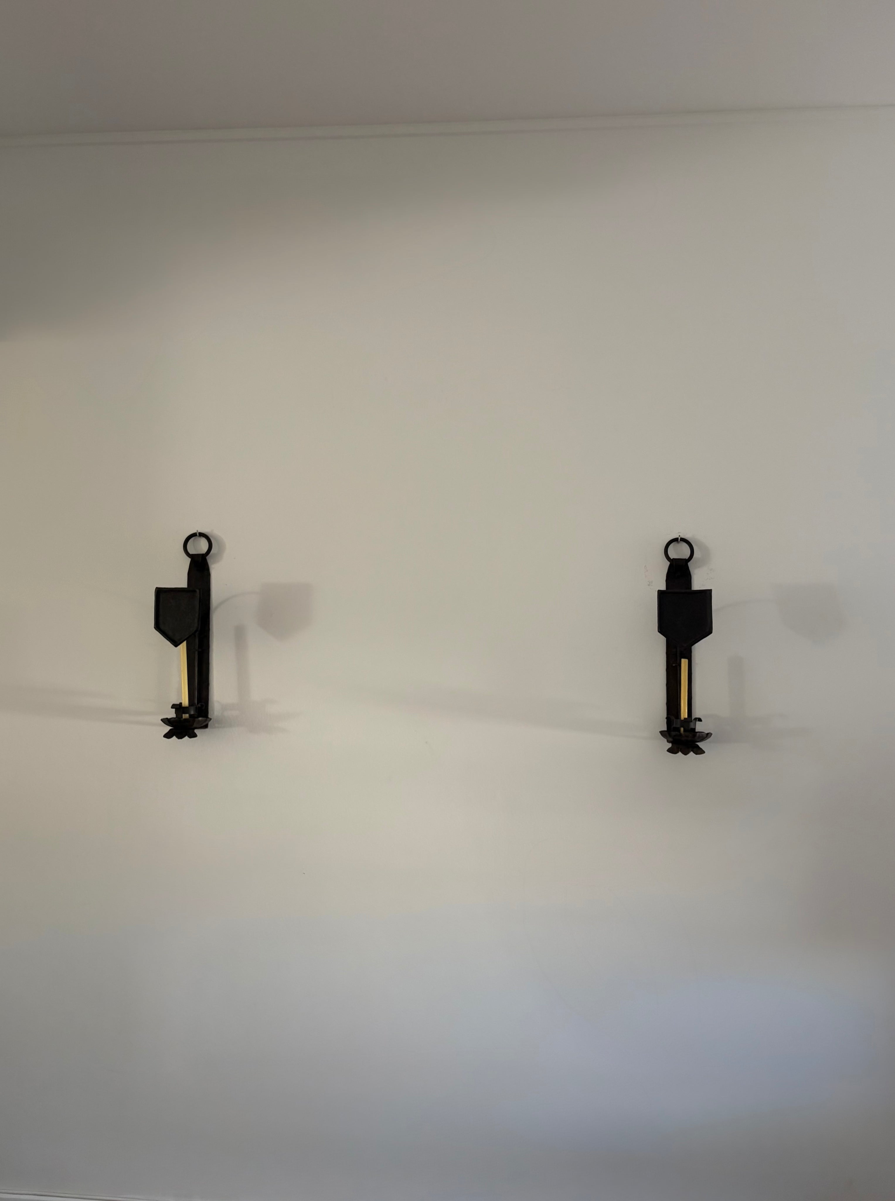 Pair of Hand-Forged Wall Candleholders, Trás-os-Montes, Portugal, c. 1900–1910 — lifestyle setting