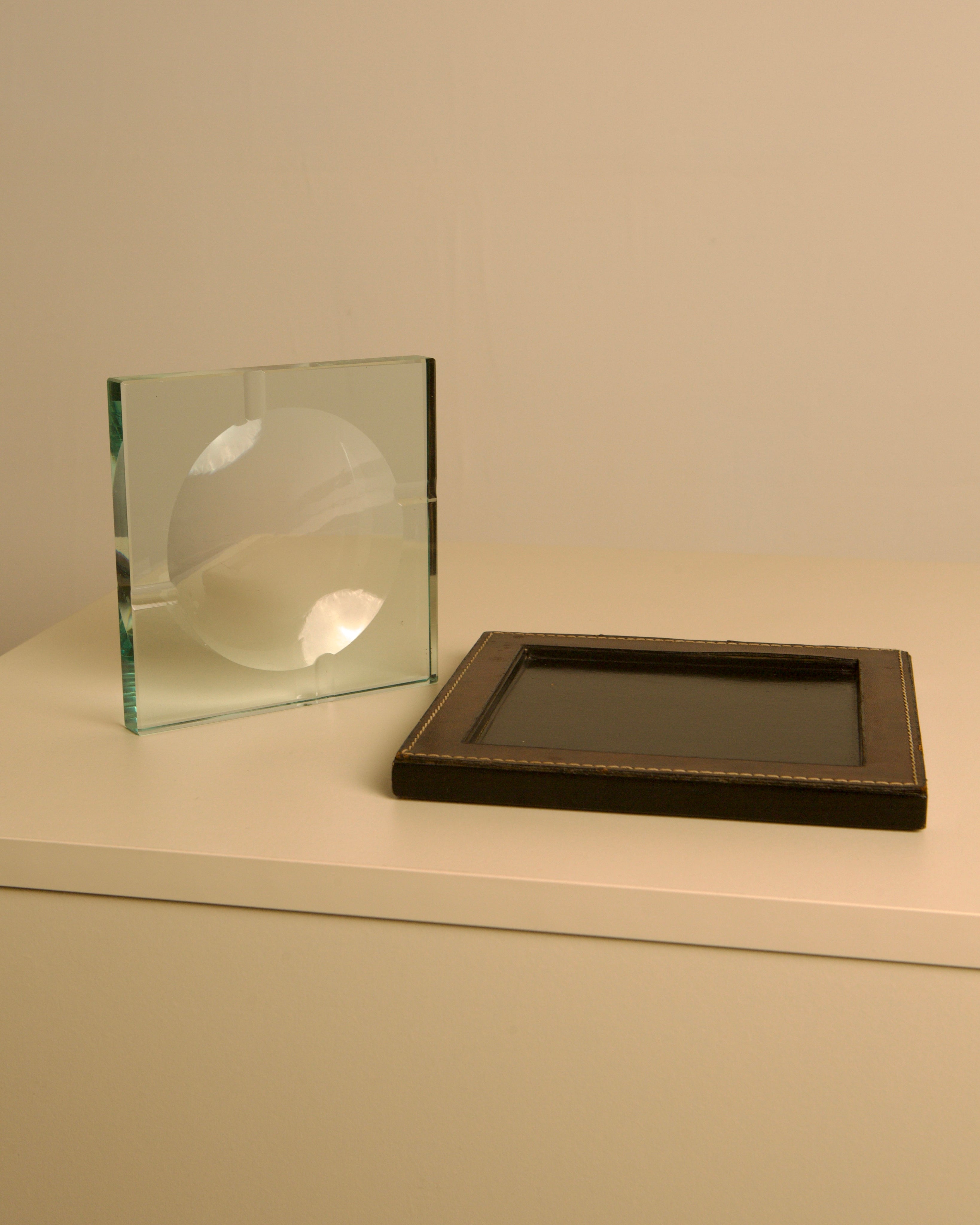 Square Italian Ashtray in Leather and Wood by Fontana Arte, 1960s — side angle on neutral surface
