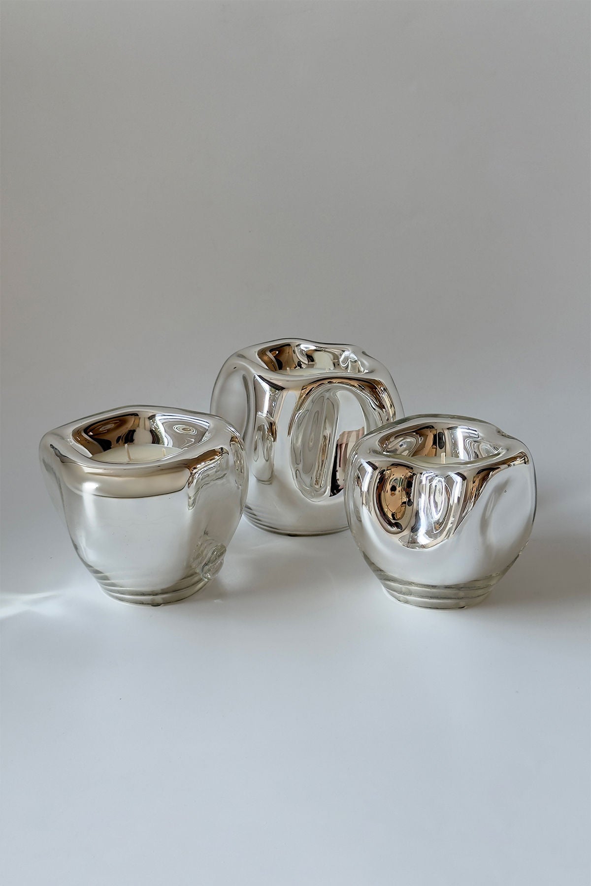 Lumi Candles — top view of silver glass candle holders