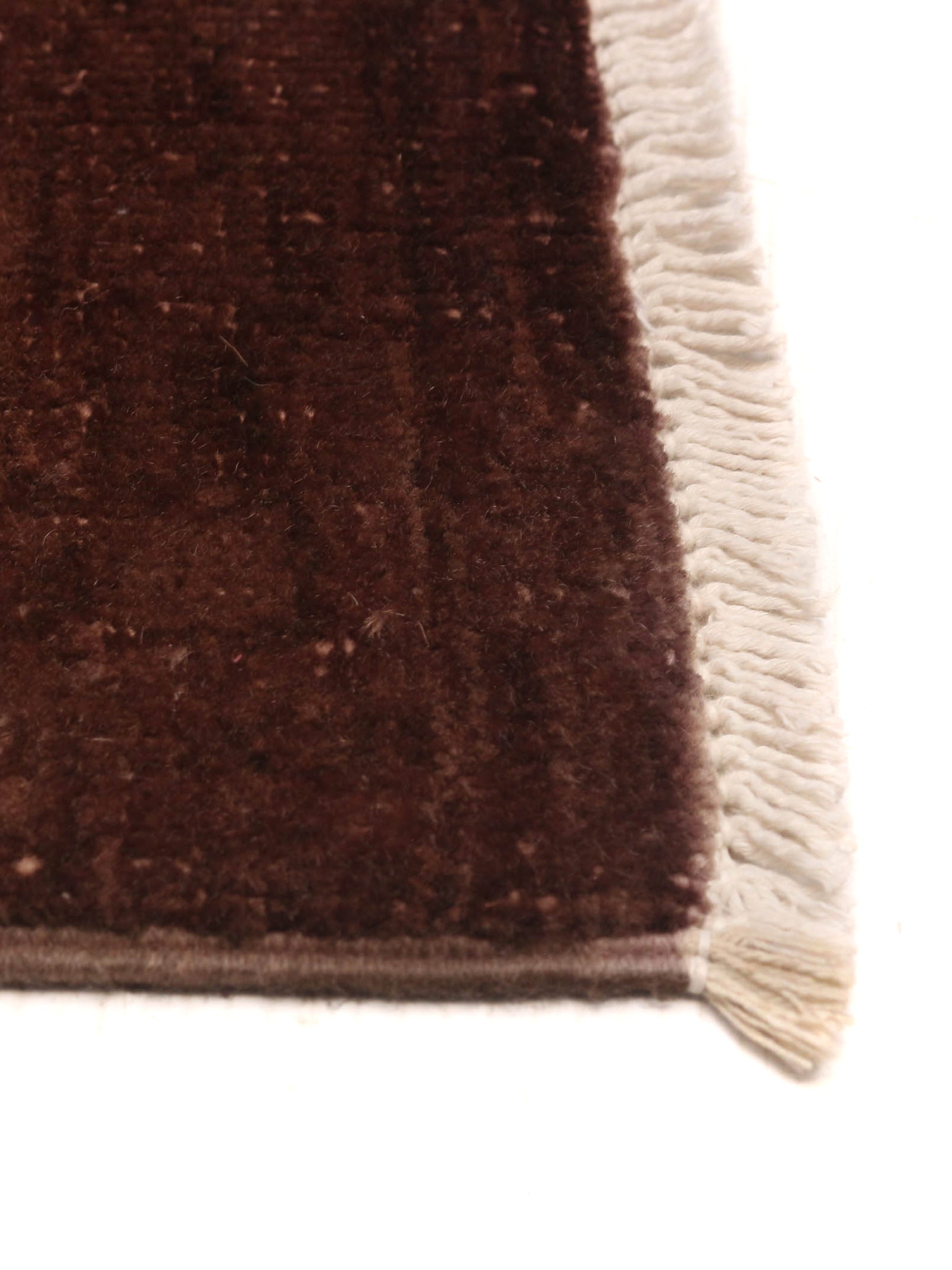 Overdyed Rug in Russet 180 x 277 cm — side angle showing soft texture and fringe