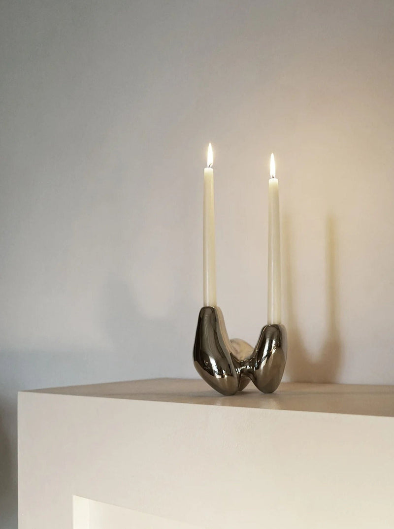 Unity Candleholder - Silver — close-up of polished silver surface with candles
