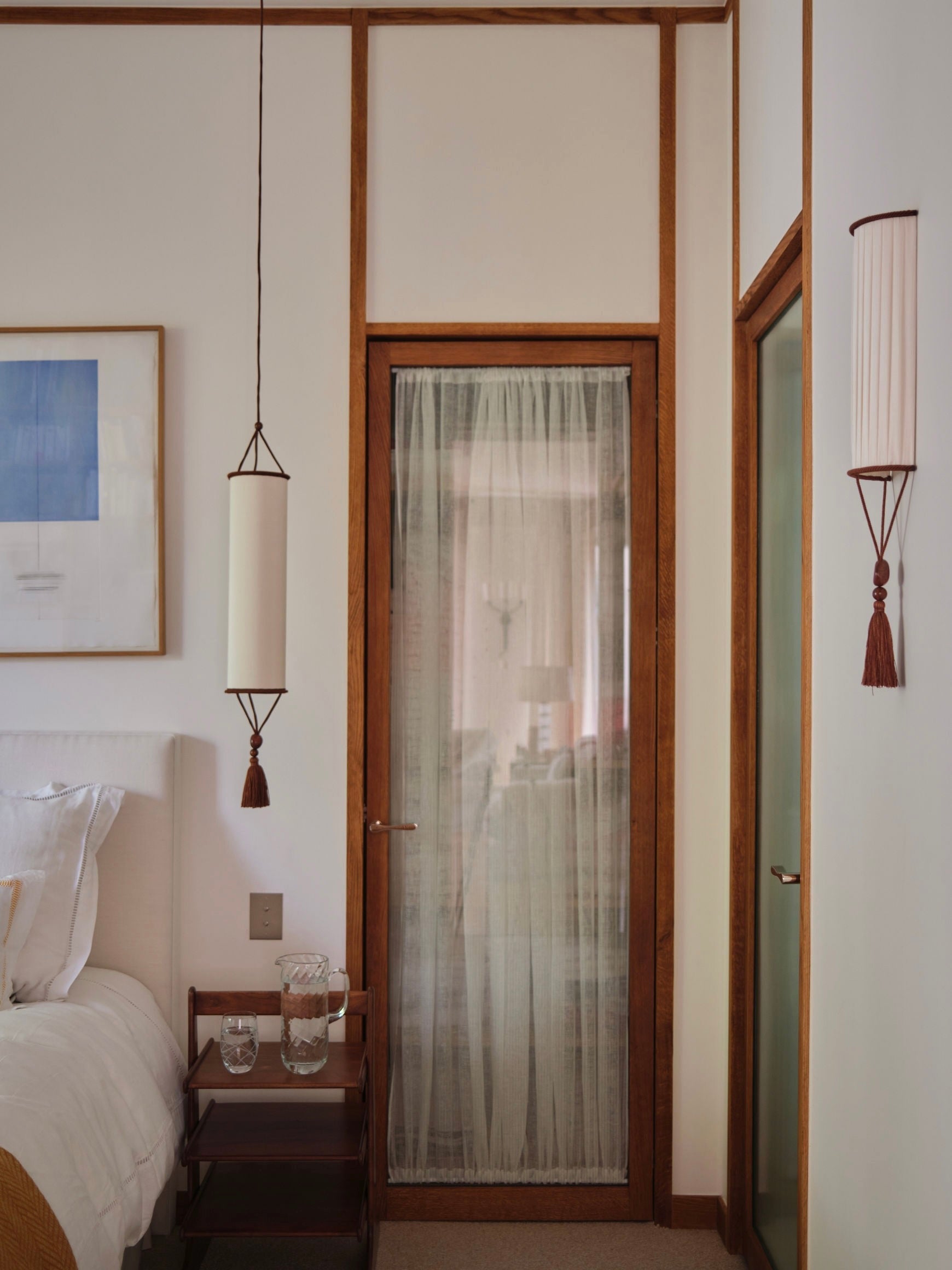 Betty Pendant Lamp — hanging in modern bedroom setting
