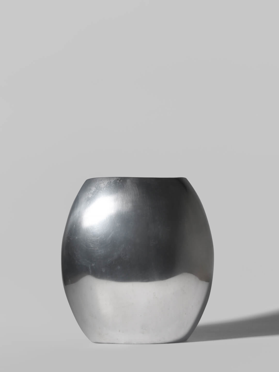 Polished Aluminum Flat Rounded Vase by Vintage Stories | The Oblist
