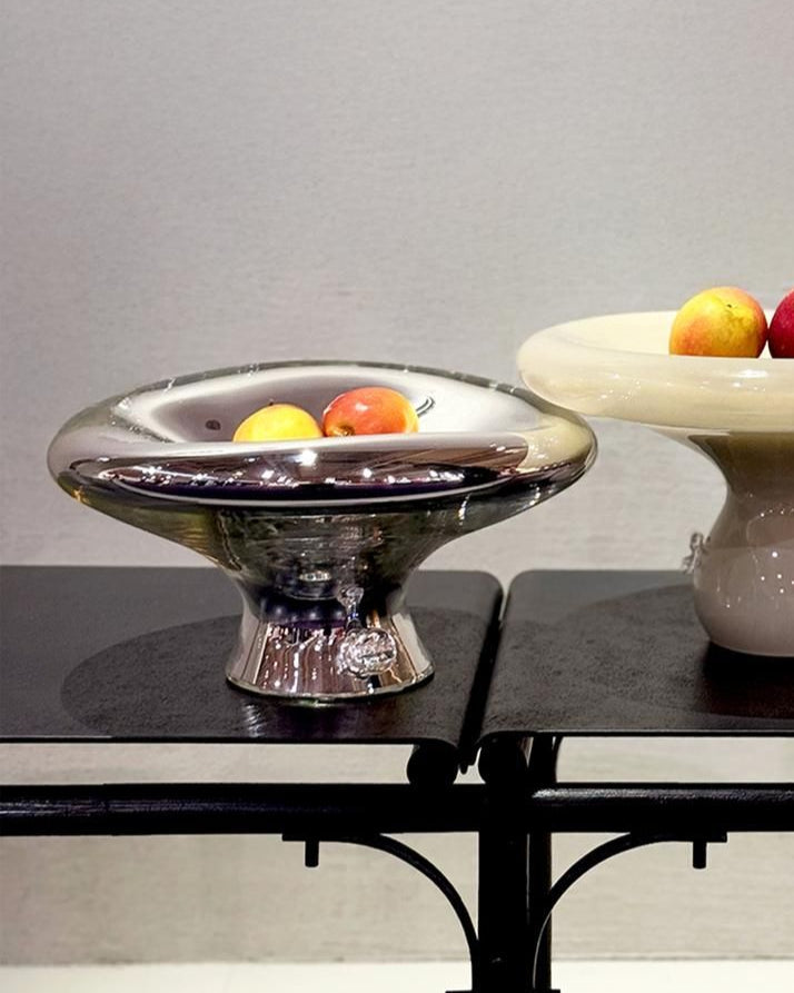 Sylve Mirror Plate — close-up of reflective glass surface with apples