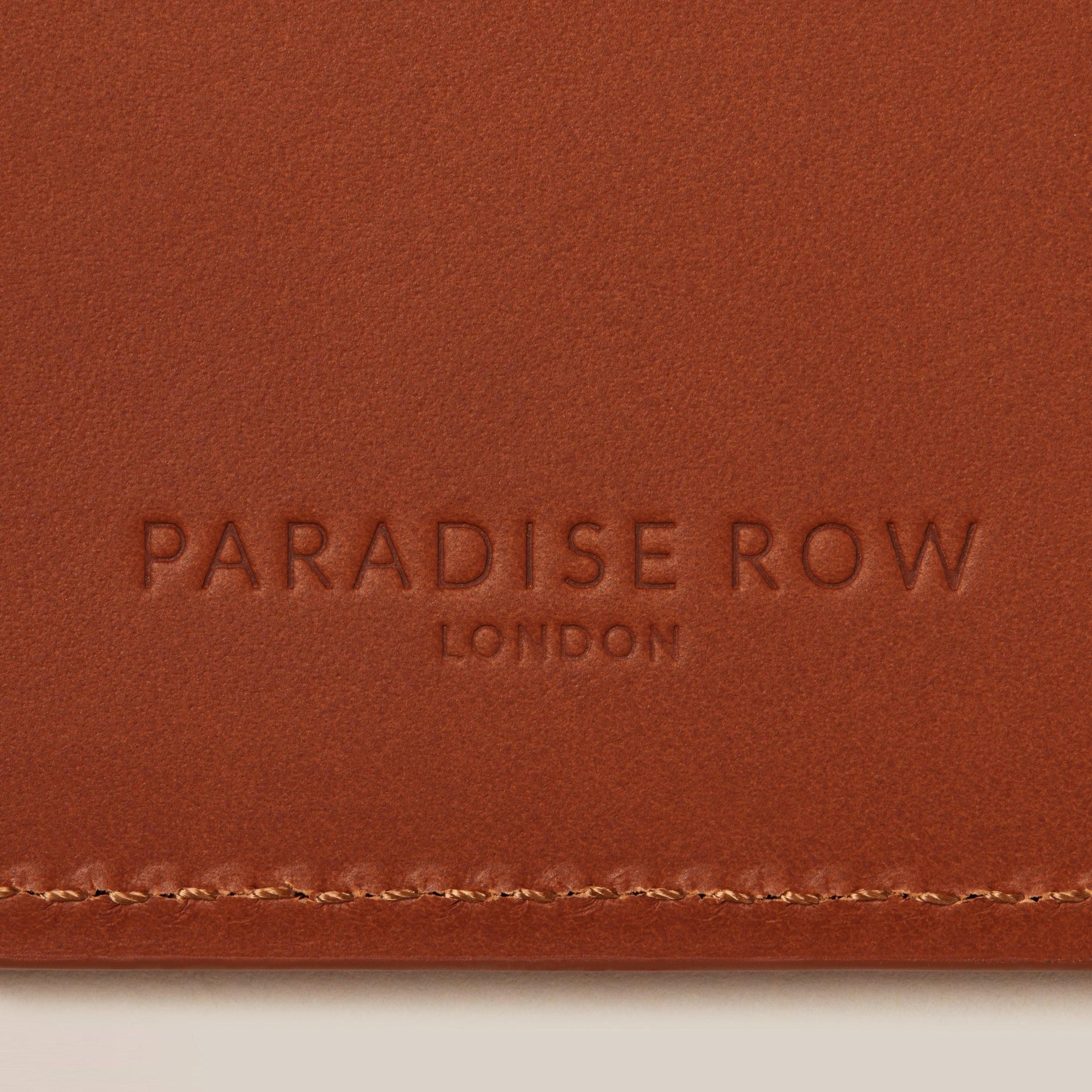 Leather Passport Holder — close-up of rich brown leather texture