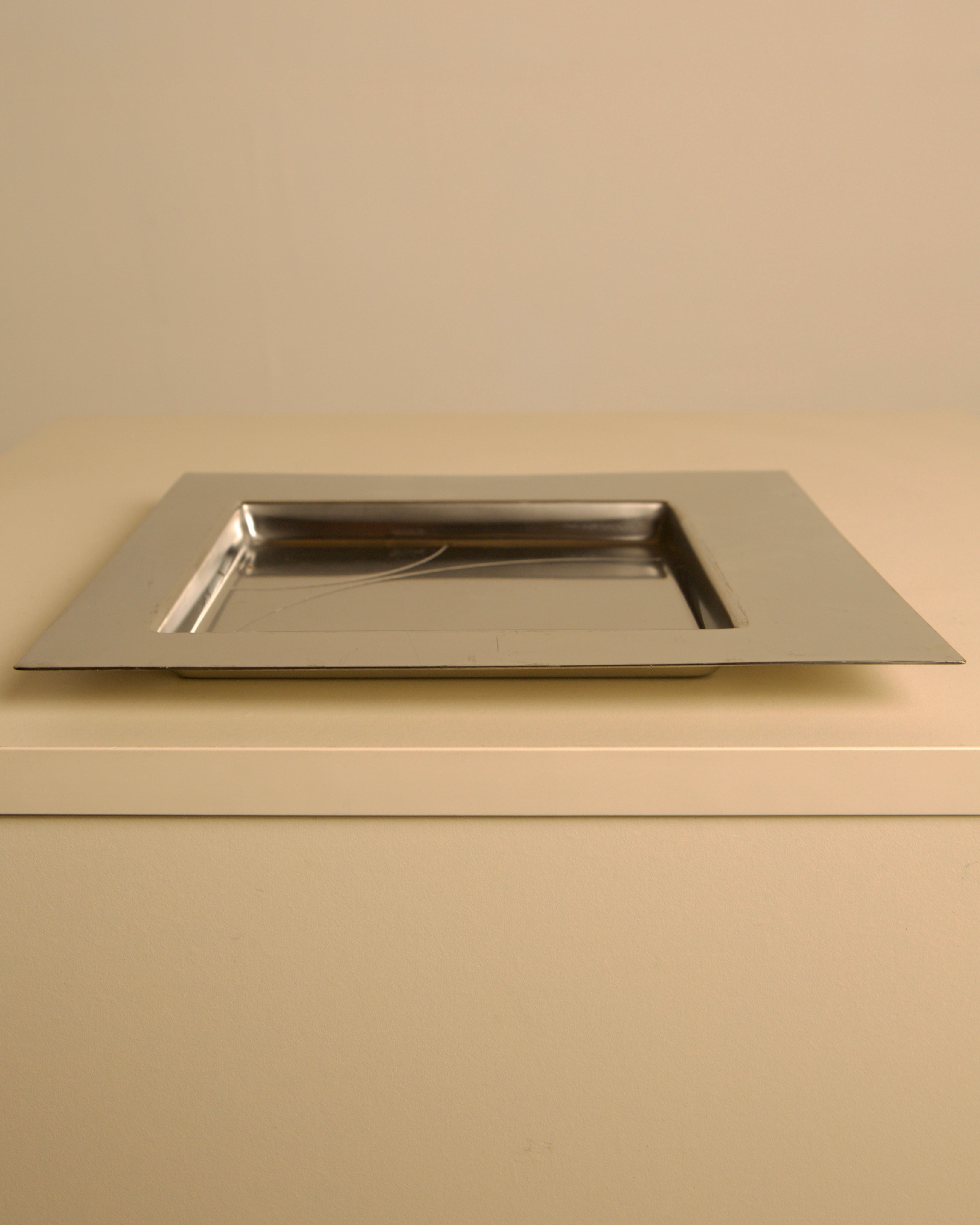 Metal tray by Mattia Pastorino for Cleto Munari 70's — lifestyle setting