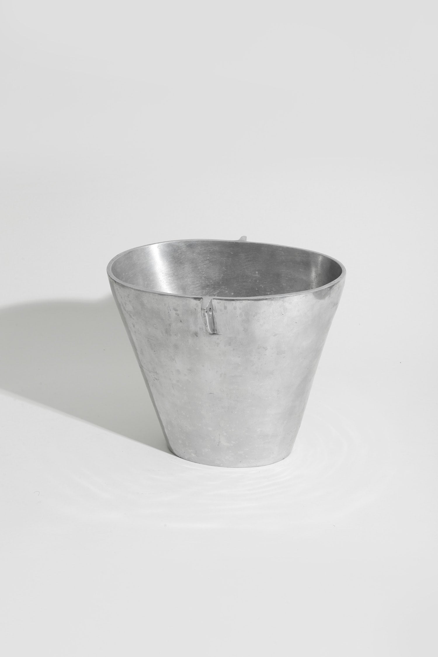 Form Sculpture Chrome Vase — top view of metallic surface