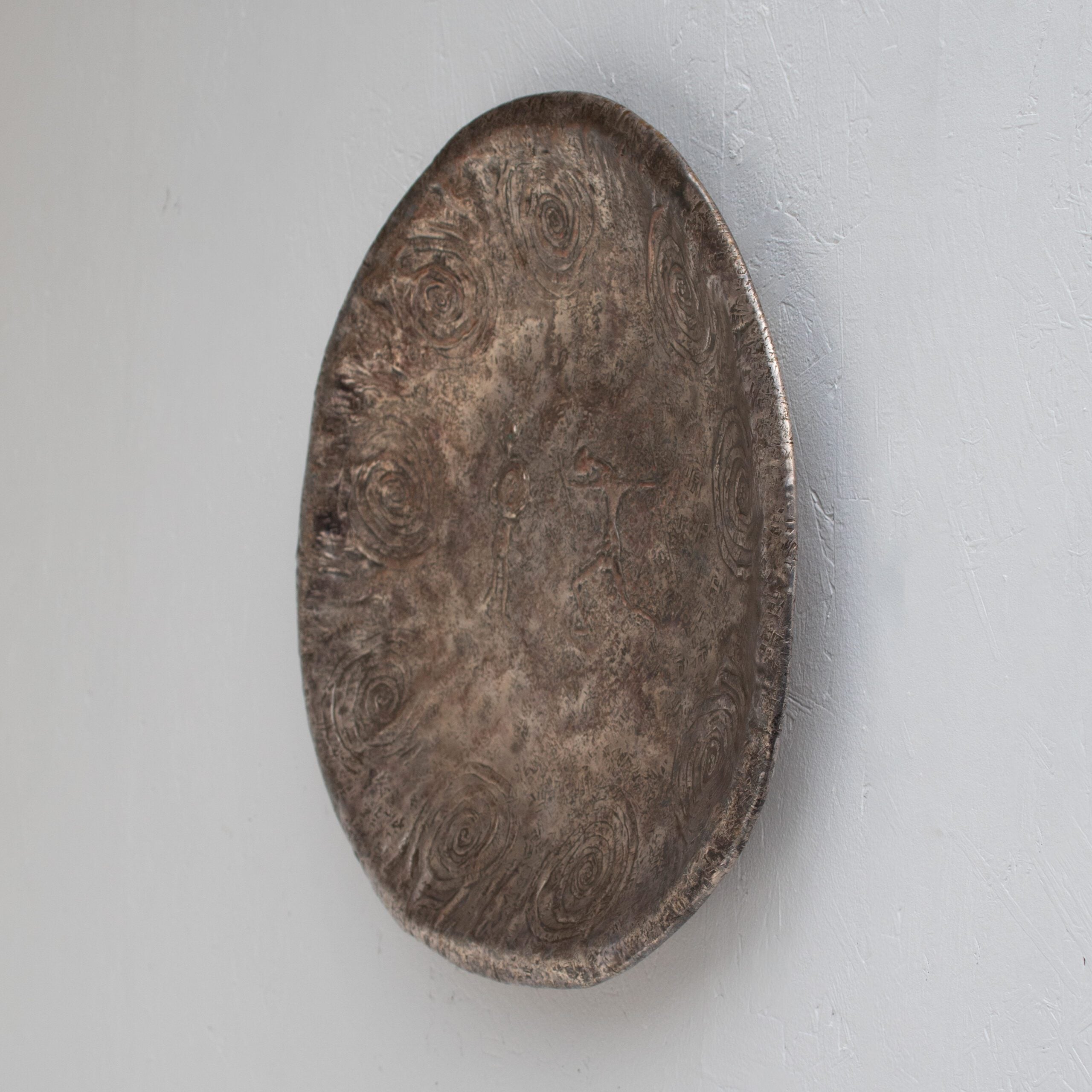 Bragalini Wall Art with Spiral Relief Motif in Hammered Metal — side angle