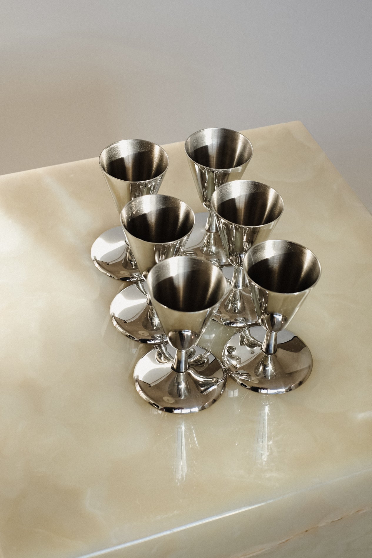 Set of 6 Coupes — side angle on glossy surface