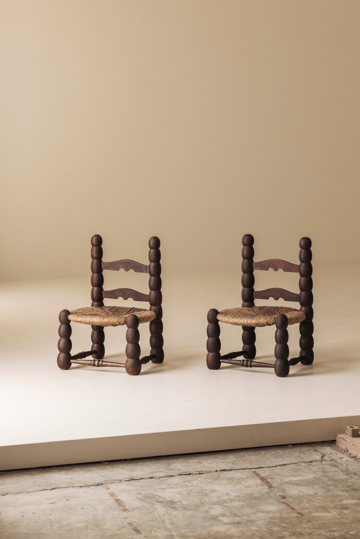 Pair of Spanish Bobbin-Turned Side Chairs with Rush Seats, Early 20th Century — lifestyle setting