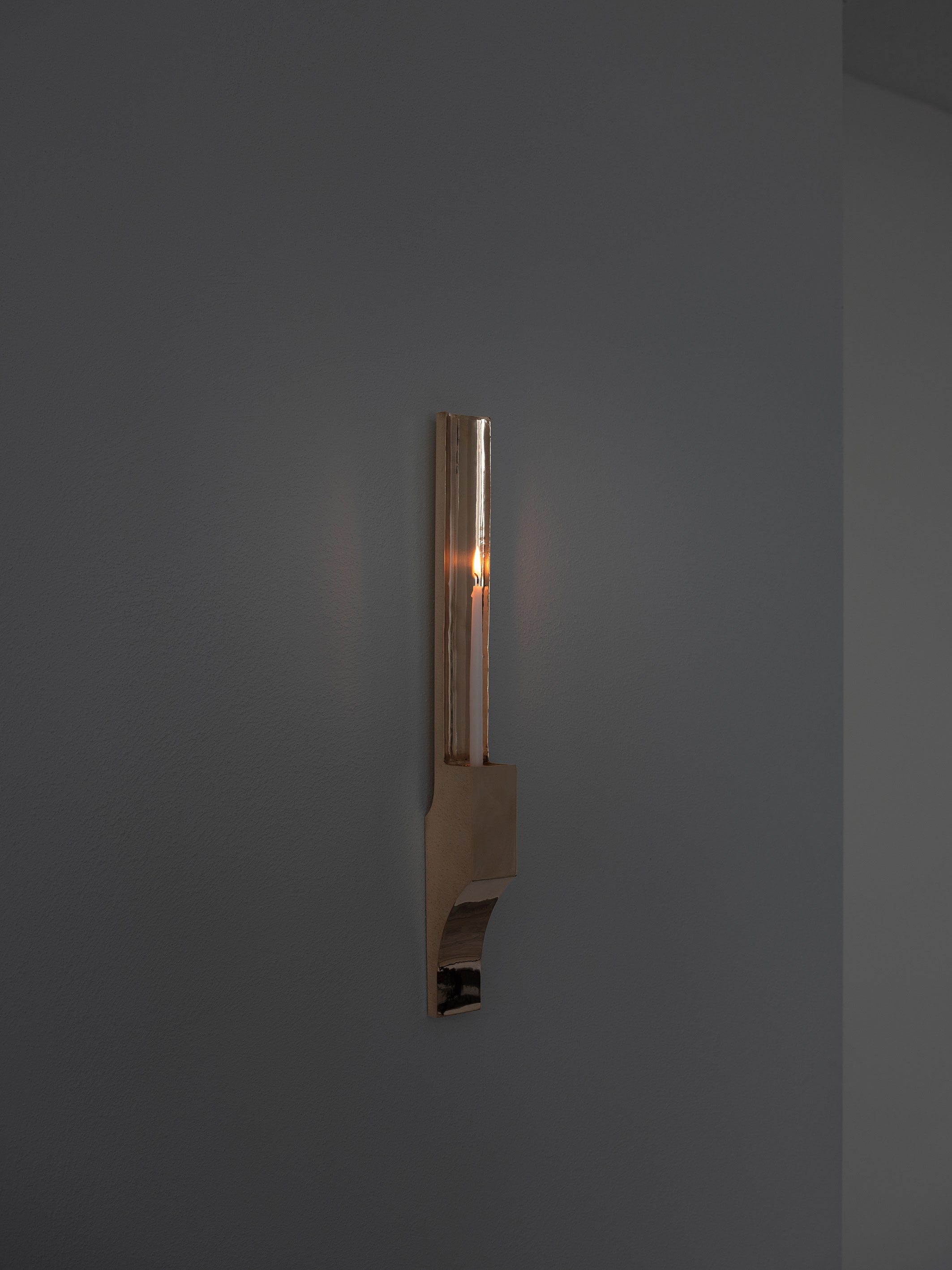 Case obj.8 - Candleholder Wall Piece — close-up of brass candleholder on wall