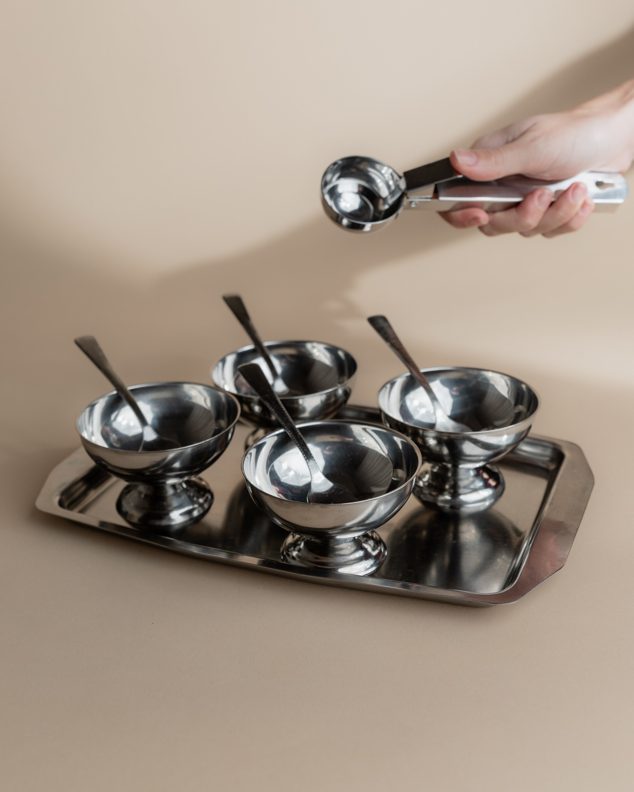 Vintage 1970s Ice Cream Serving Set for 4, Stainless Steel Cups, Spoons, Tray, Scoop — overhead view of stainless steel cups