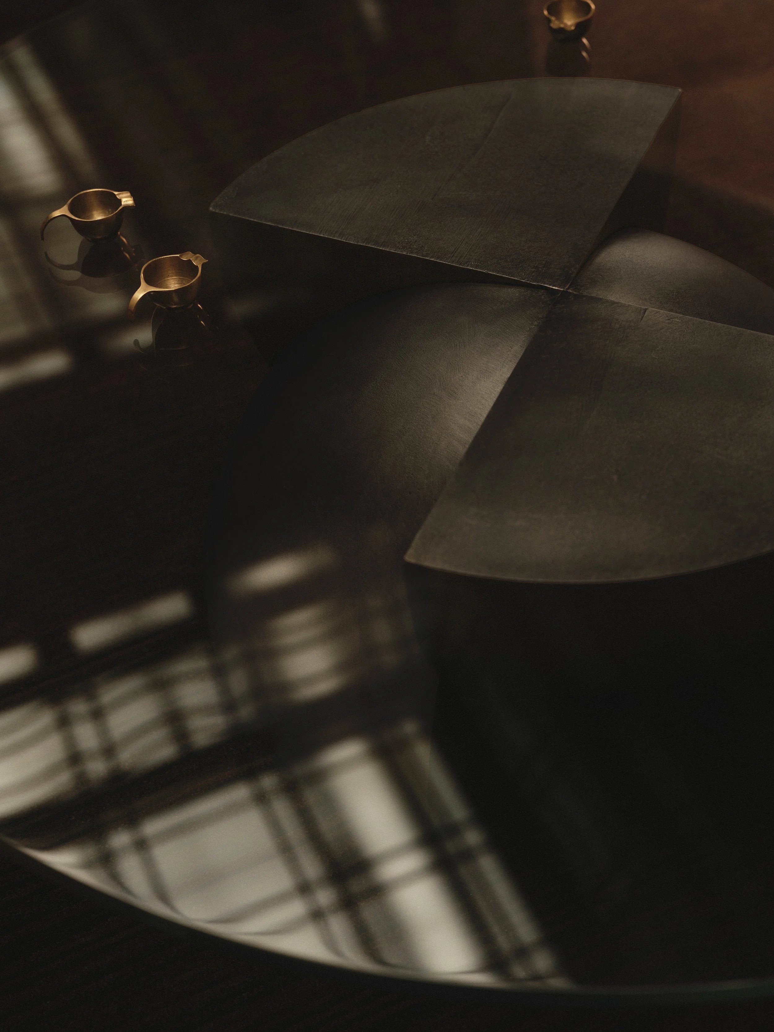 Glass and Cast Brass Coffee Table in Dark Bronze Patina - Axis by Studio Brocky — close-up