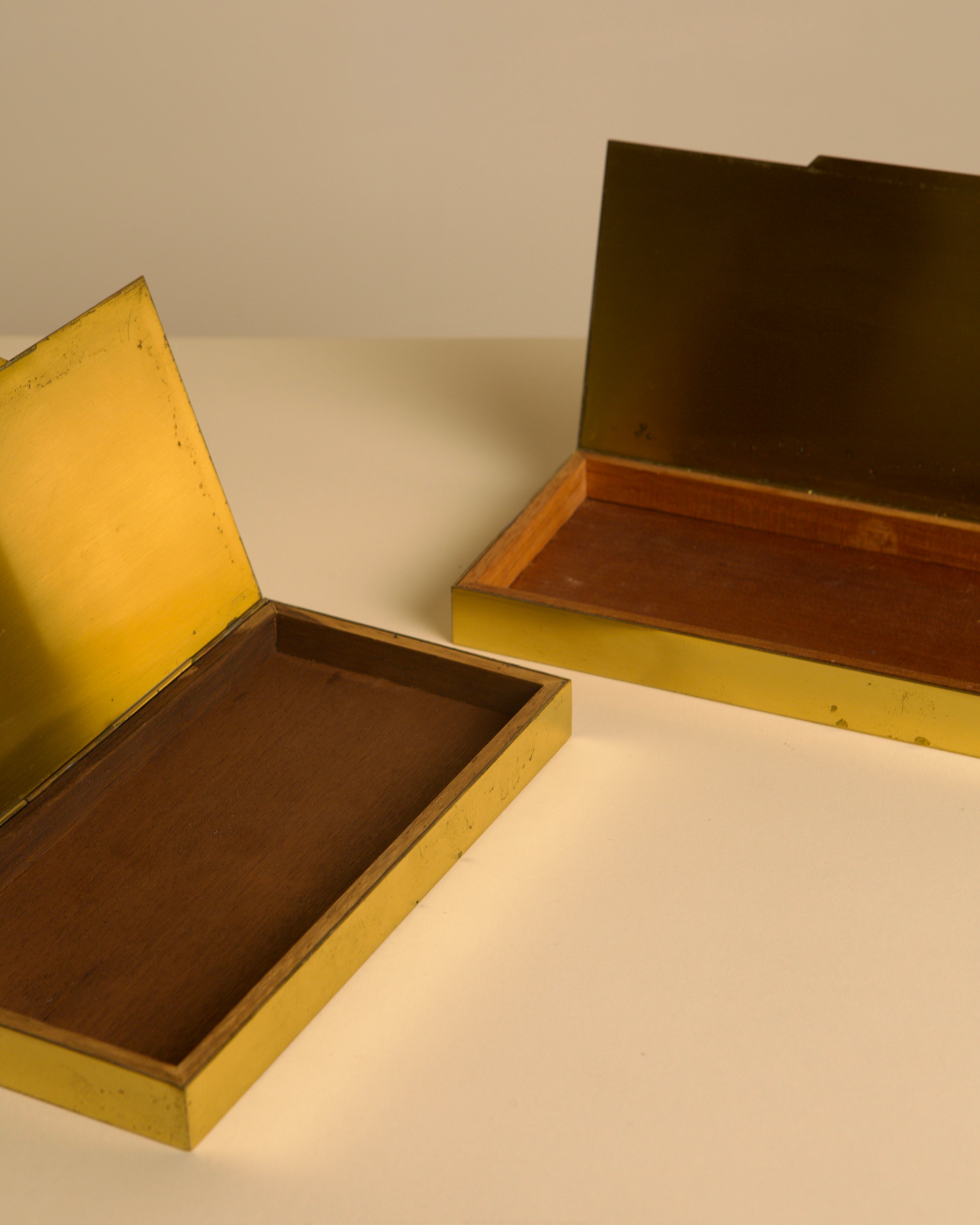 Open Italian brass and wood boxes showing interior compartments