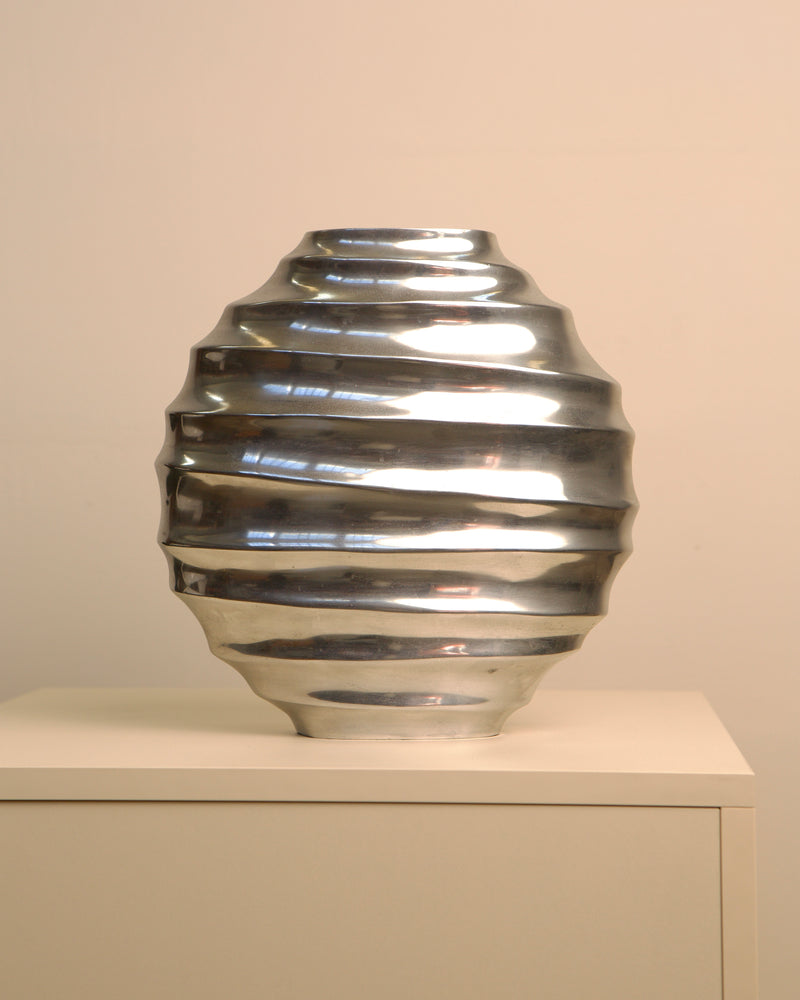 Ribbed aluminum vase with sculptural spiral design detail view