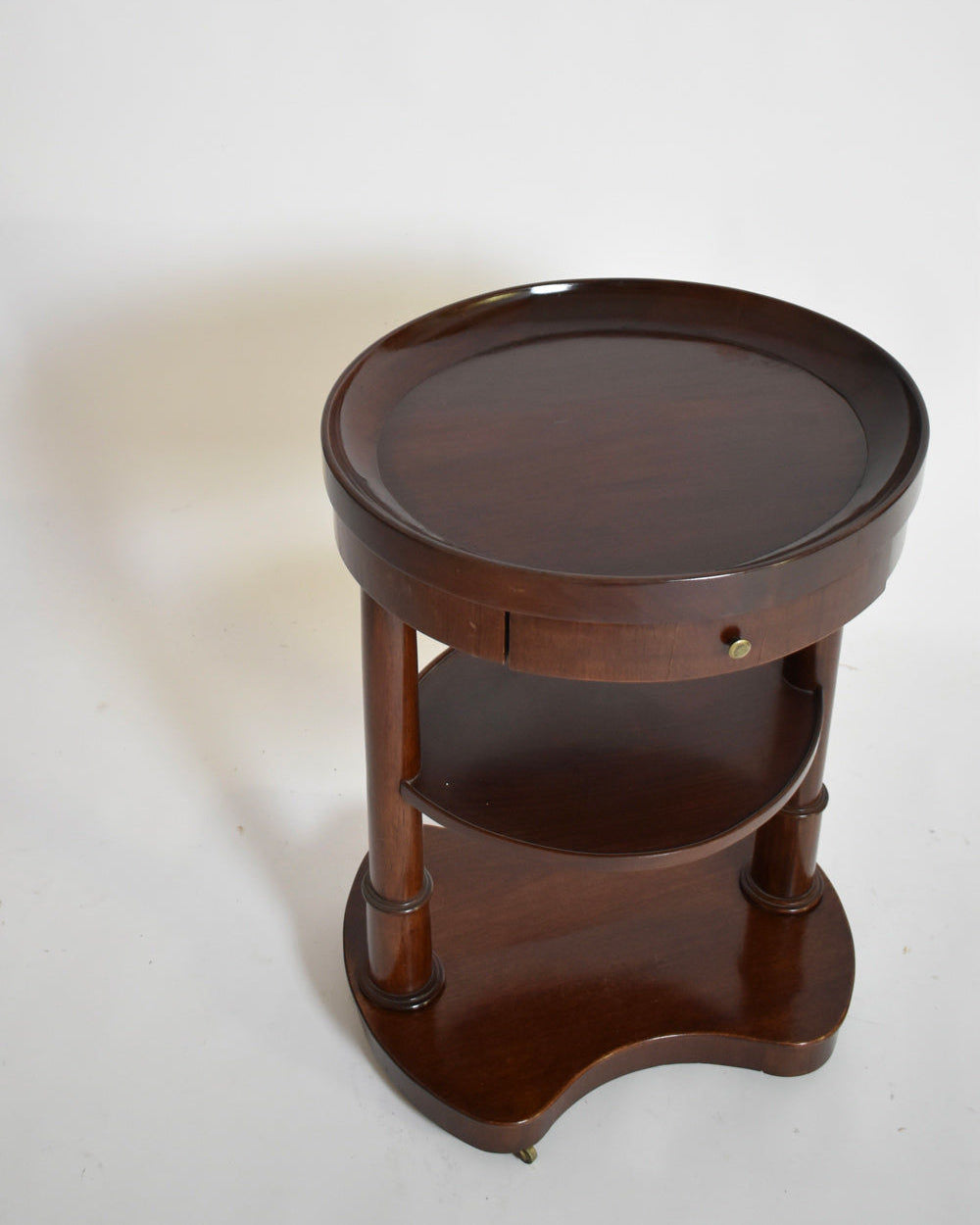 Pair of Mahogany Kidney Ovale Tables, XIXth c. — top view showing round surface and lower shelf