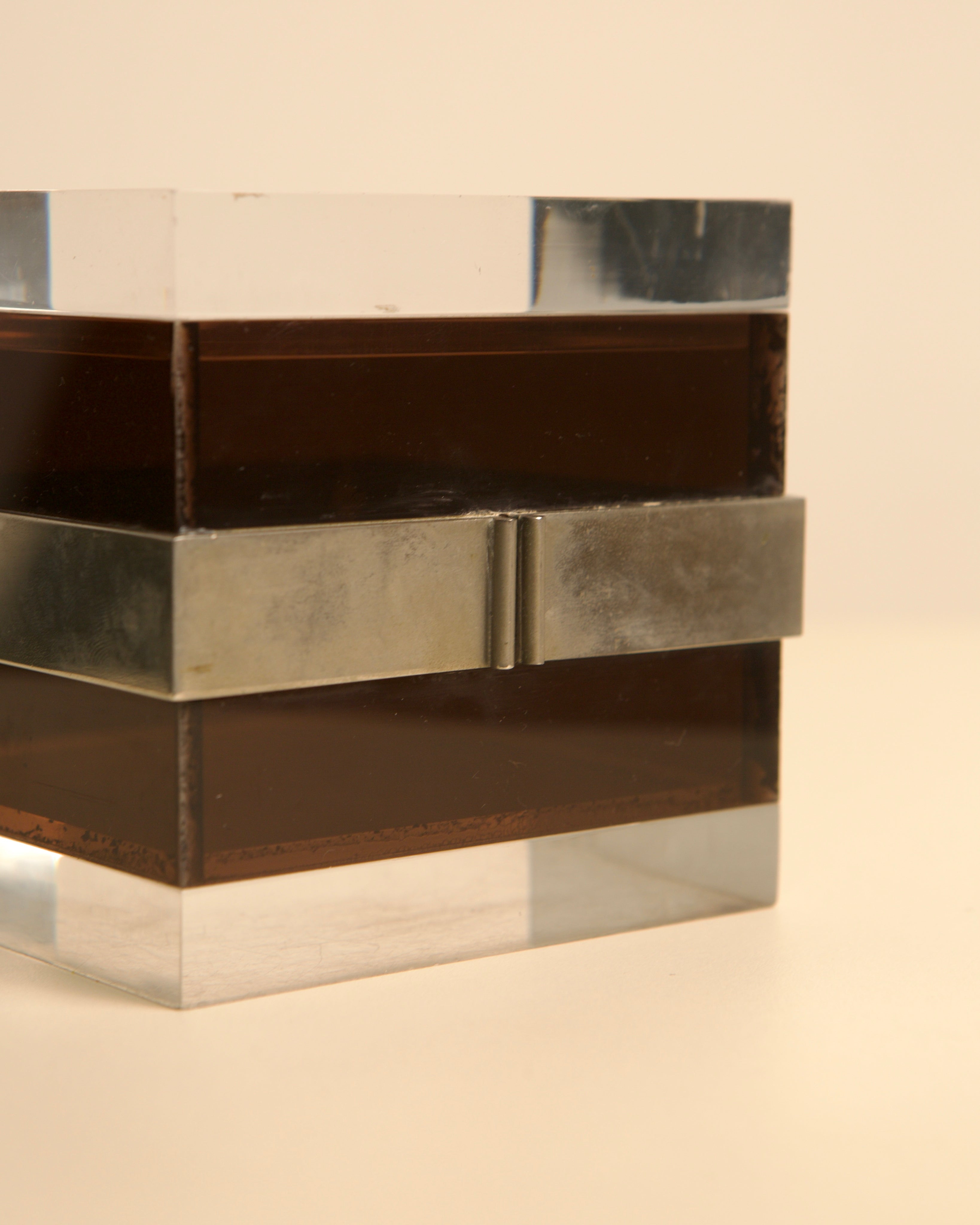 Cubic box detail showing stacked metal and wood compartments by Alessandro Albrizzi