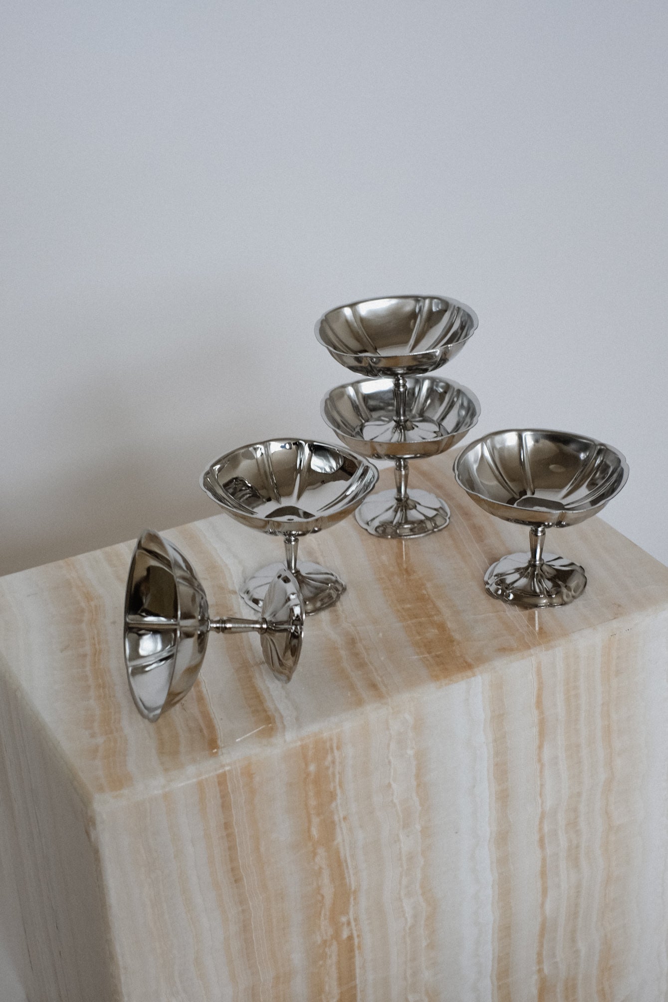 Set Large Ice Coupes — side angle on marble pedestal