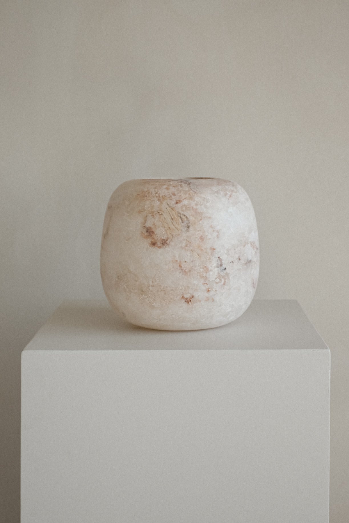 Alabaster Candle Holder — front view on white pedestal