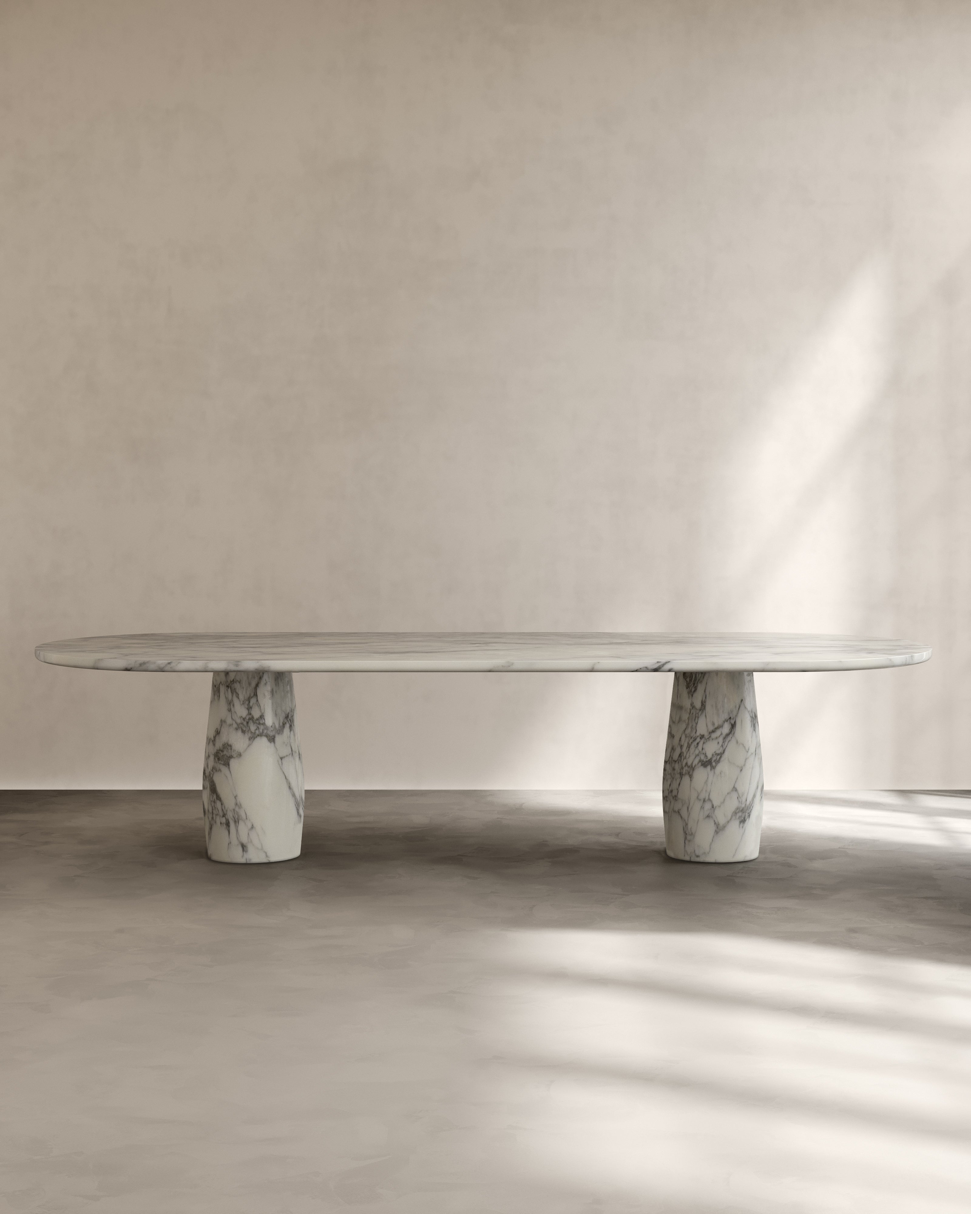 Raffaella Table IV — modern oval marble dining table in neutral setting