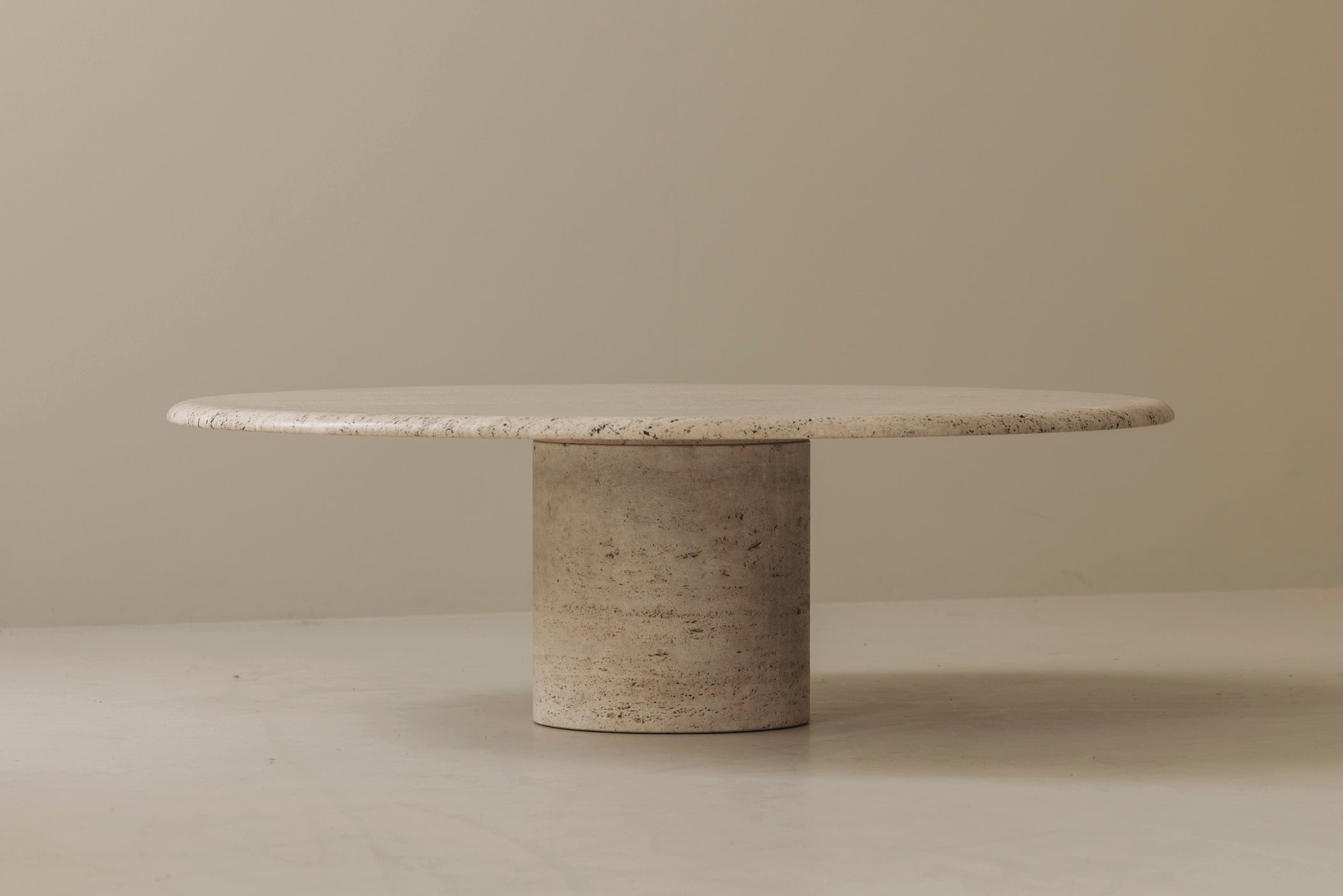 Travertine round coffee table by Angelo Mangiarotti, Italy 1970s — in context