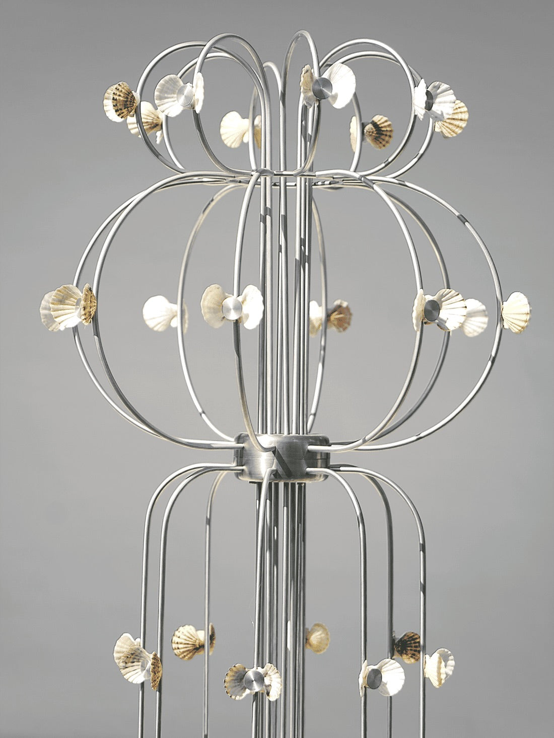 The Floor Lamp With Shells — side angle showing metal frame and shell accents