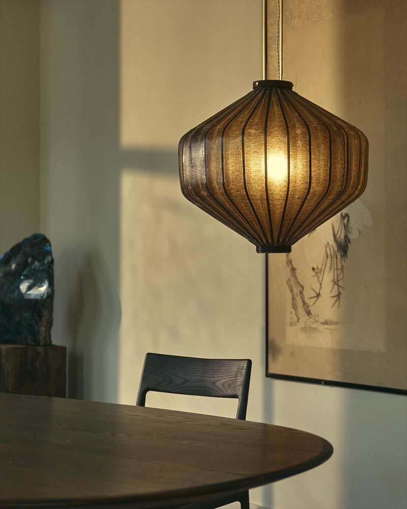 Shui tuolo-shaped pendant light with ribbed fabric shade over dining table