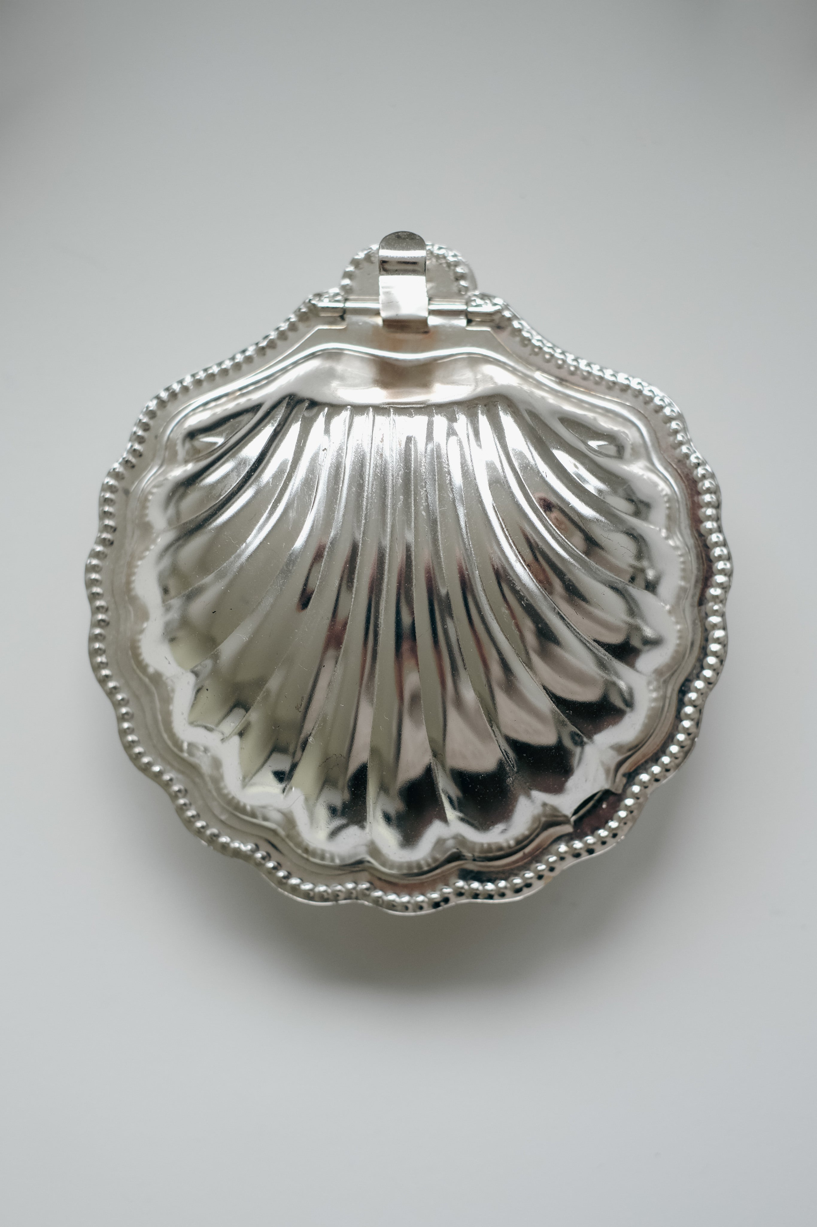 Shell Shaped Butter Dish — top view of polished silver surface