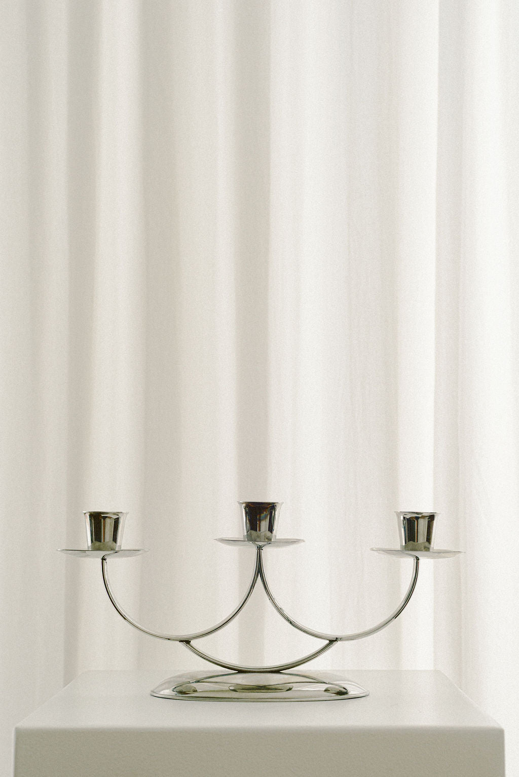 Three-Light Art Deco Candelabra — close-up of polished metal finish