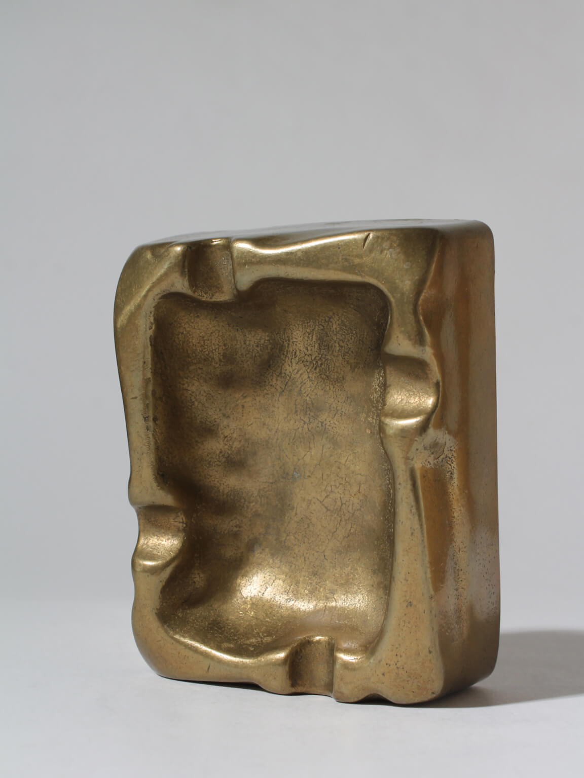 Solid Brass Organic Ashtray — close-up