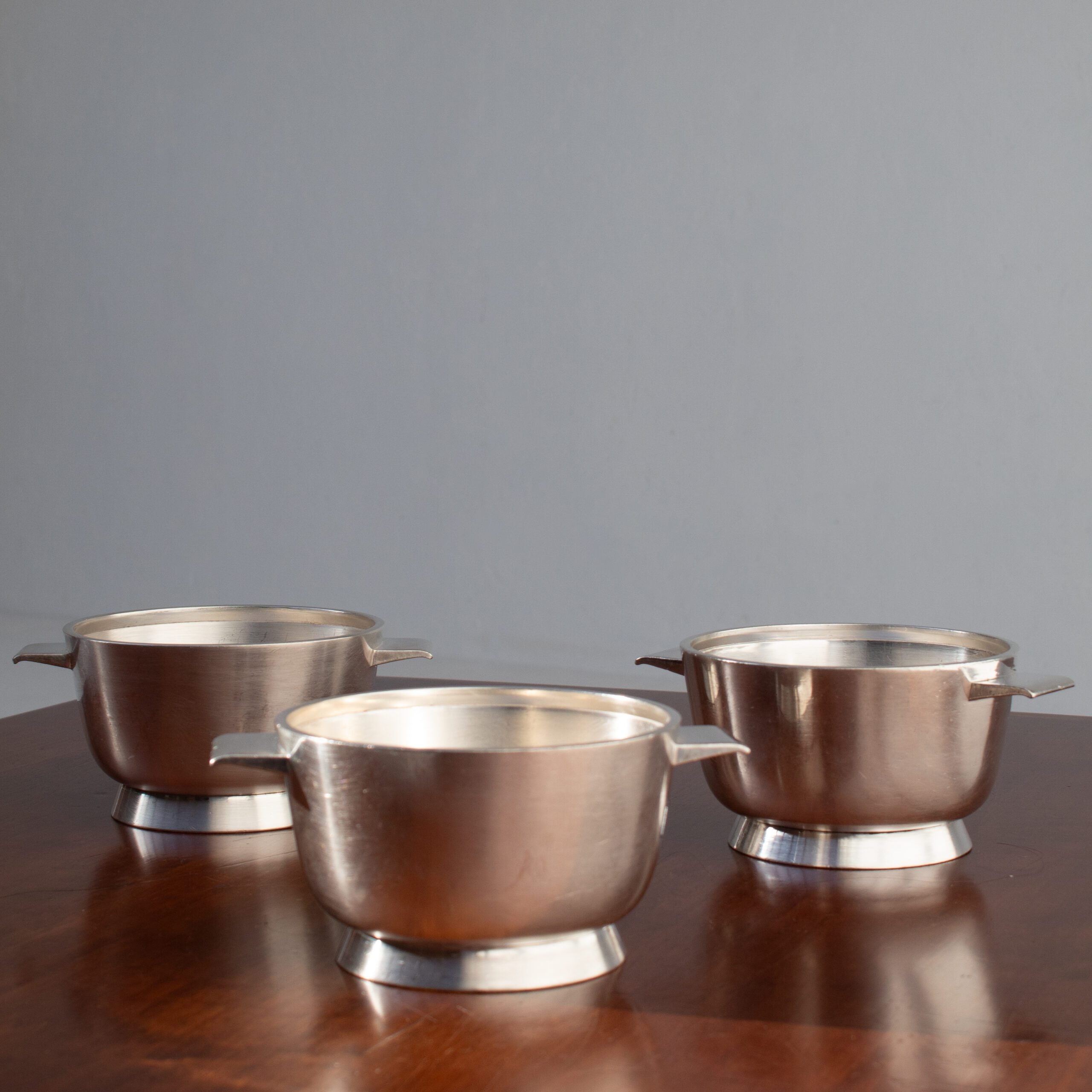 Arthur Krupp Milano Silver Plated Bowls Set — side angle on wooden table