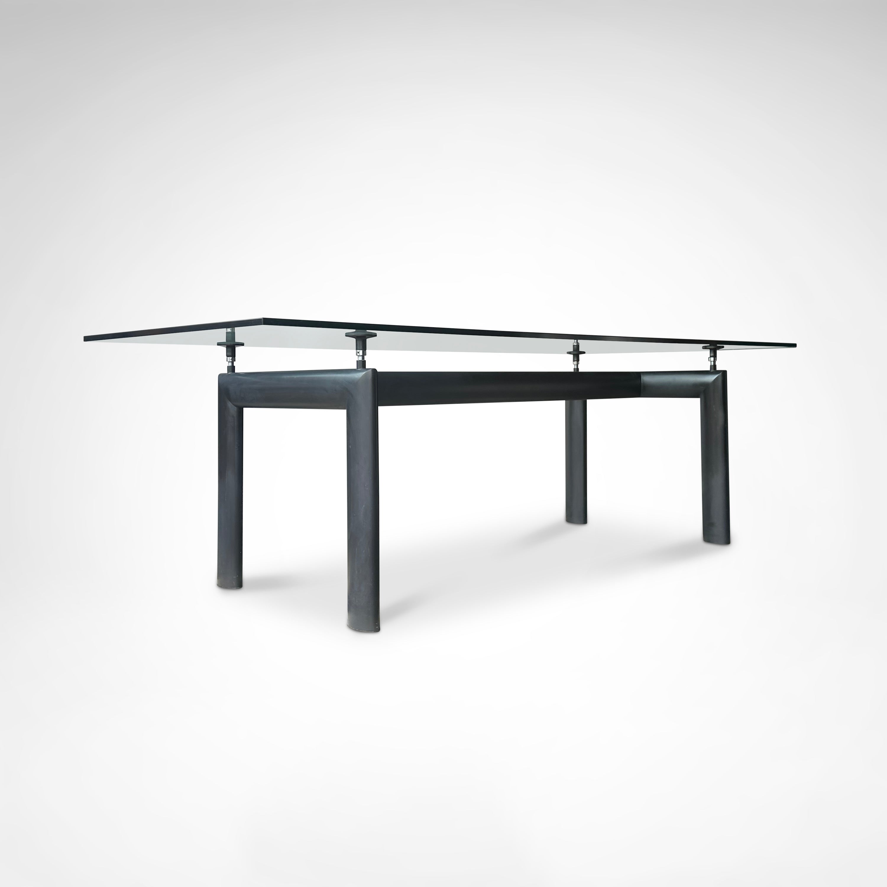 LC6 Dining Table by Le Corbusier et al. for Cassina 1990s — angled view highlighting glass top and metal legs