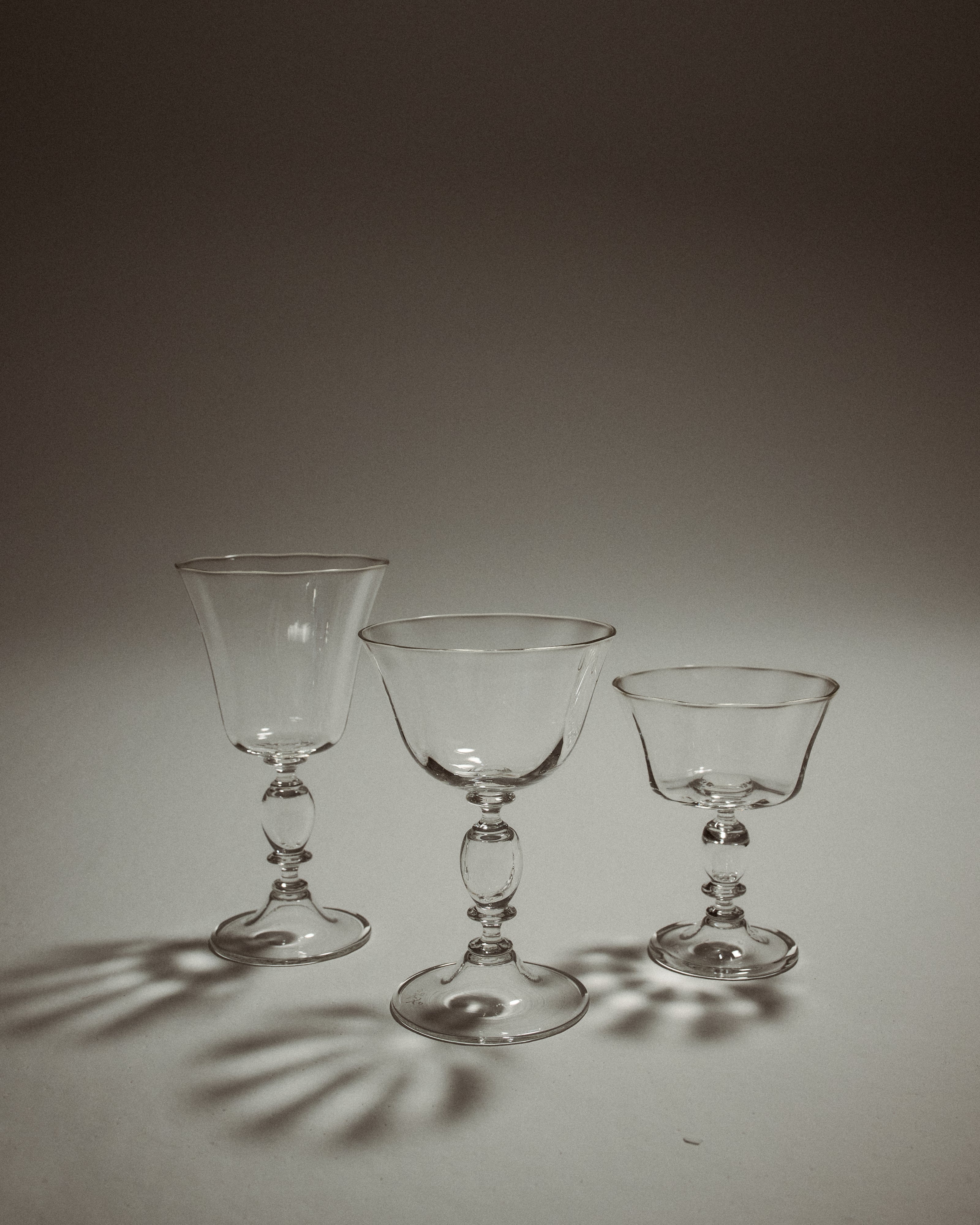 Alban Wine Glass Large - Set of Four — three glass sizes on neutral background