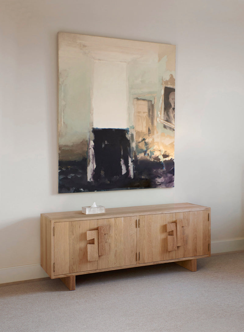 Douro Cabinet in Oak — front view with abstract art backdrop