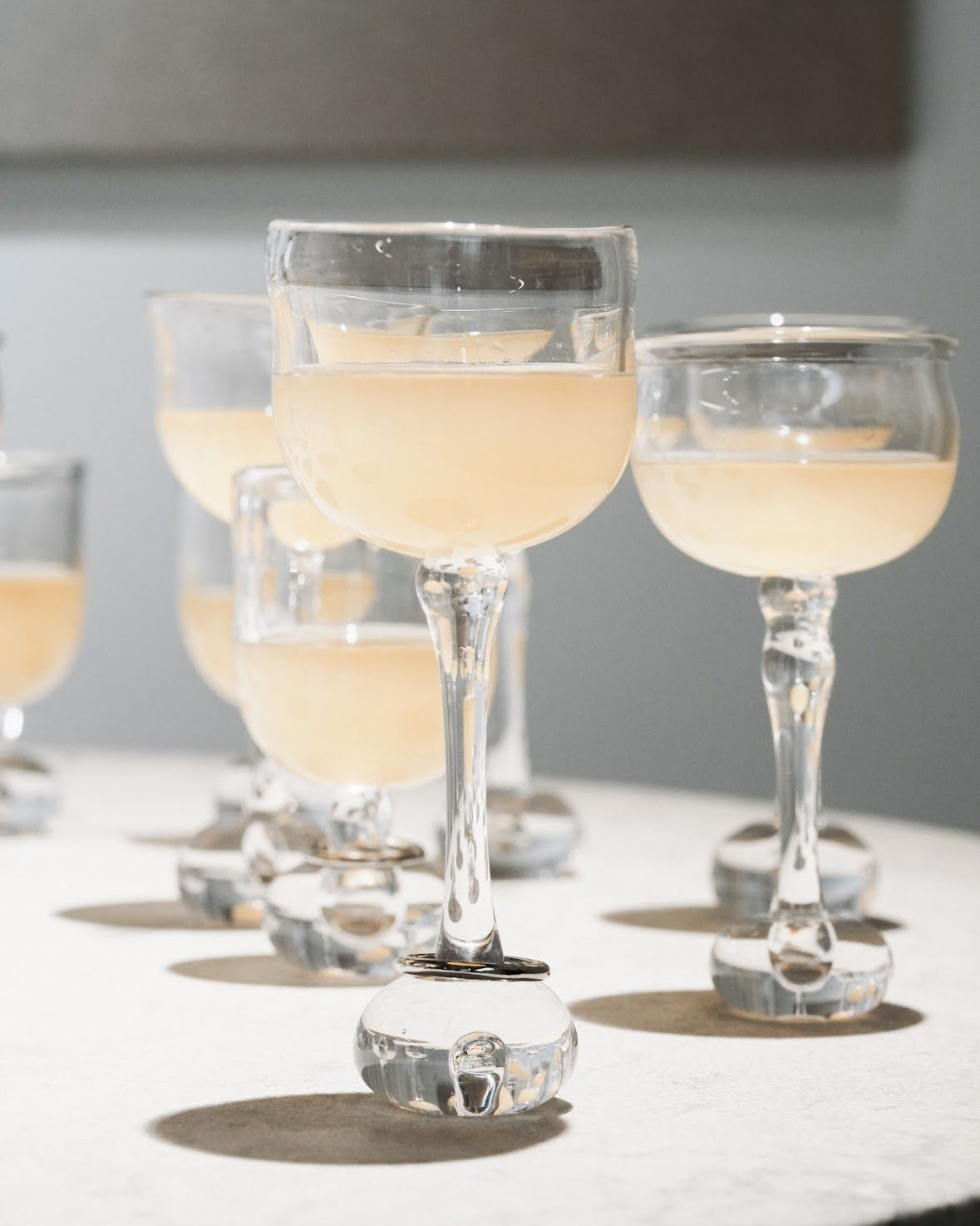 EDEN Wine Glass - Set of 2 — arranged on light marble table