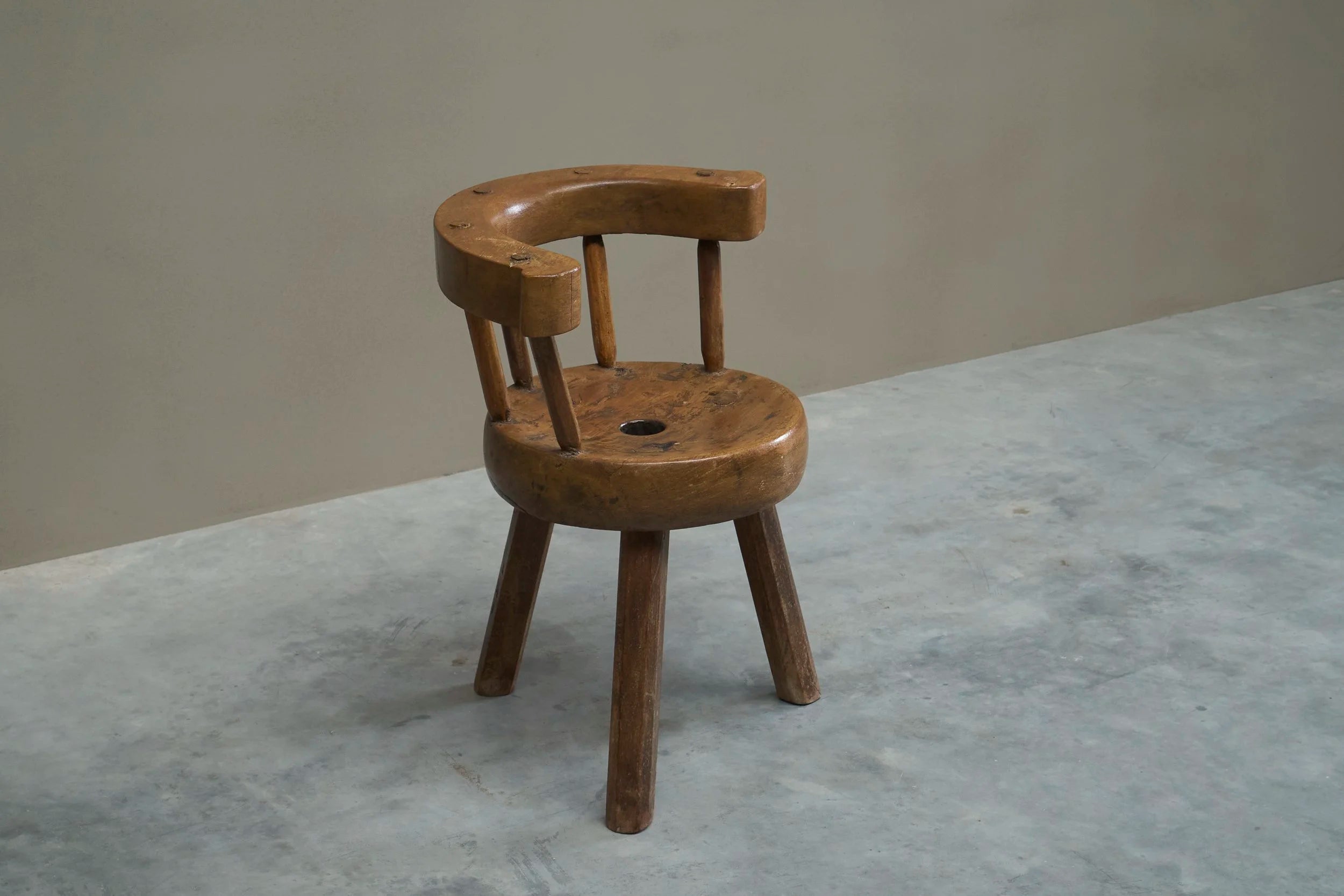 A Sculptural Three-Legged Provincial Vernacular Chair in Heavy Solid Oak France Early 20th Century — side angle