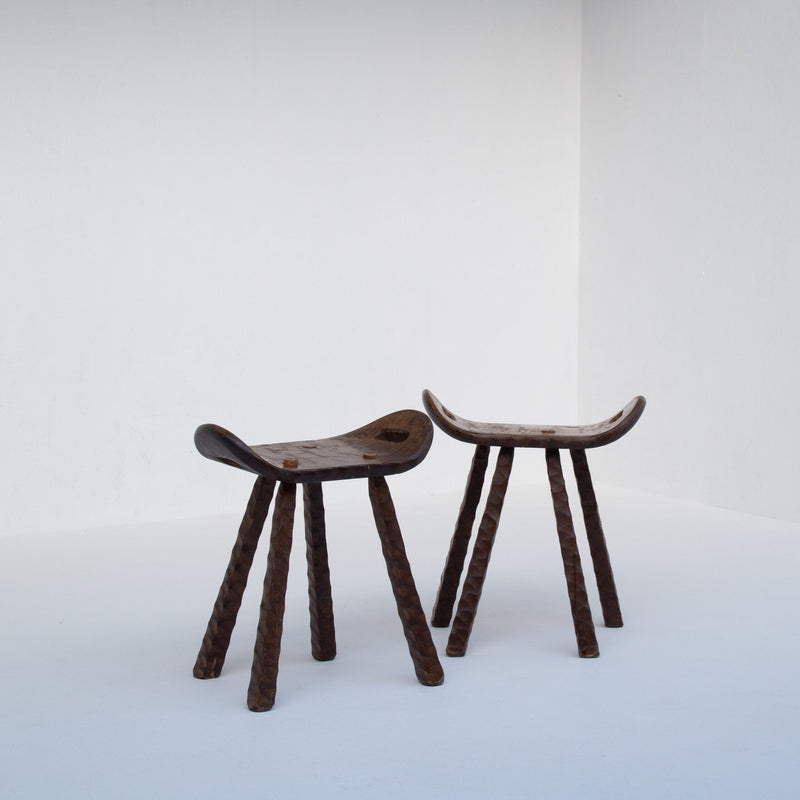 Set of Brutalist stools — close-up of dark wooden seat and legs