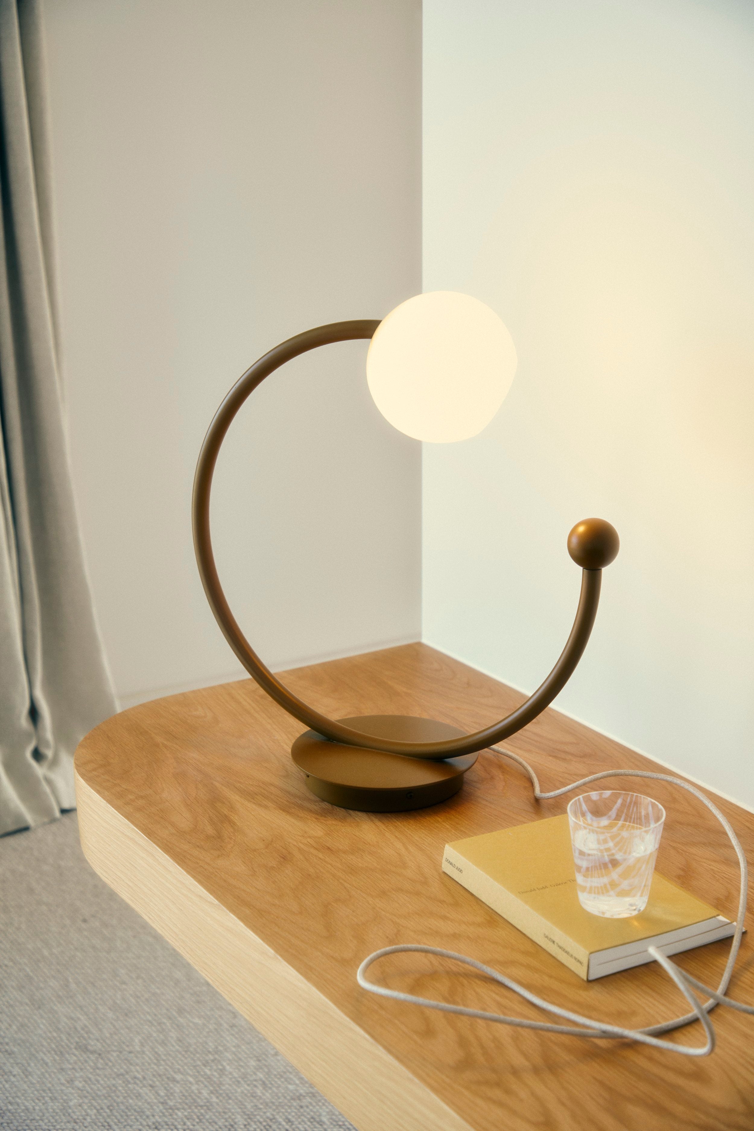 Oro Table Lamp w/ Handblown Glass — angled view on wooden table