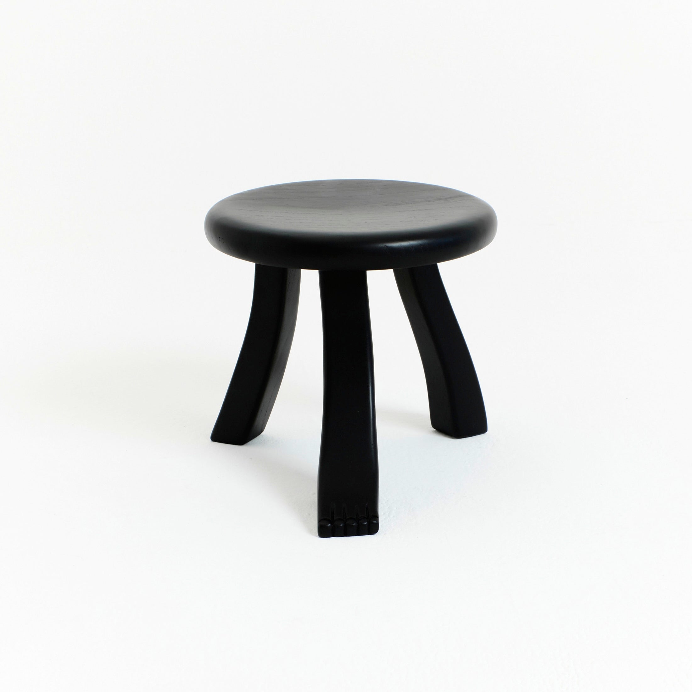 Foot Stool in Black Chestnut — side angle showing curved black legs