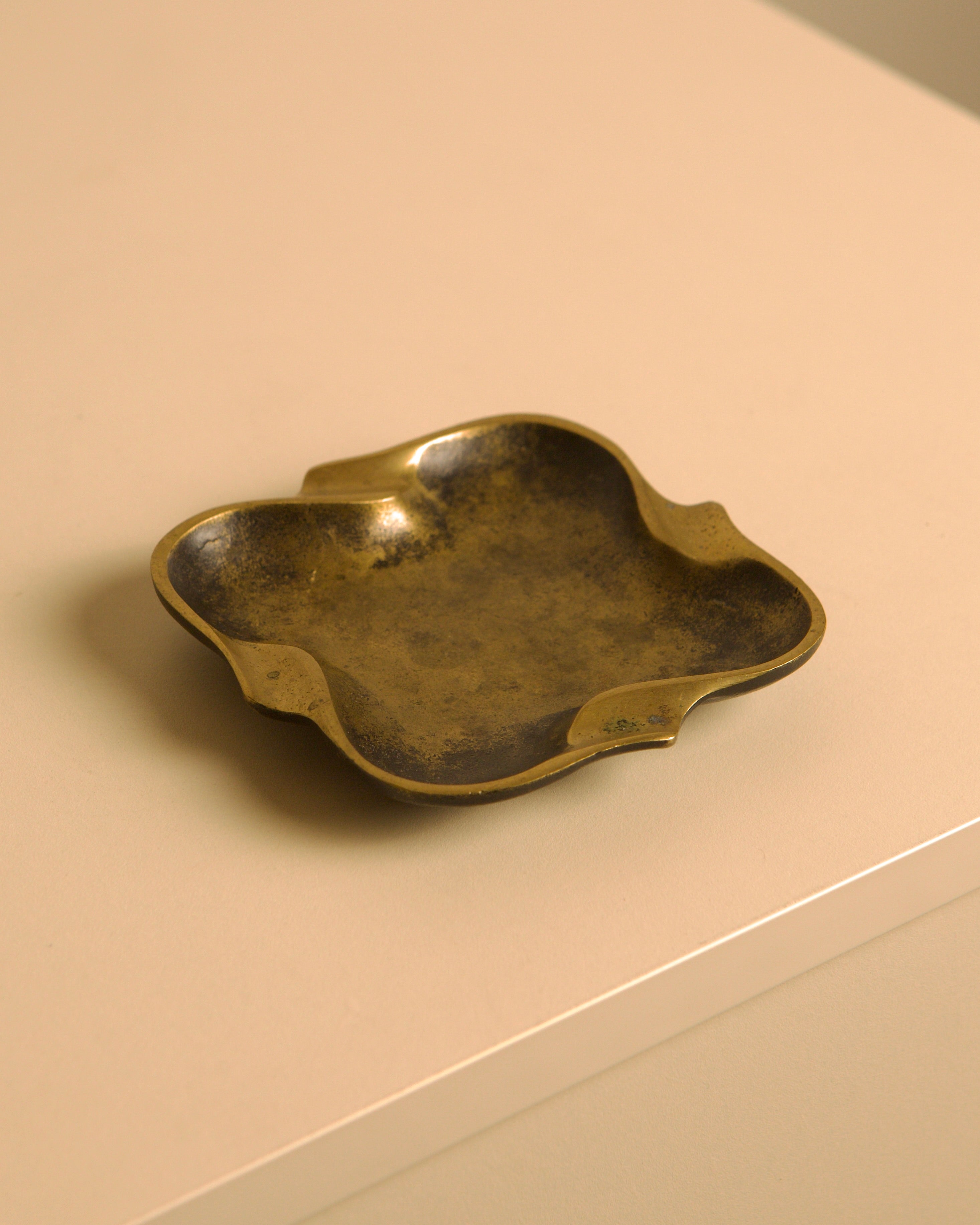 Italian Bronze Ashtray, 1940s — side angle on neutral surface